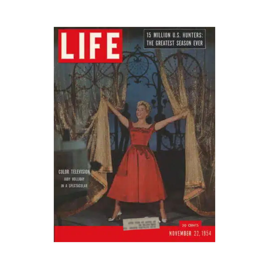 Cover of Vintage Life Magazine from November 22, 1954 featuring Judy Holliday in a red dress, celebrating color television. This collectible issue highlights the history of American entertainment in the 1950s.