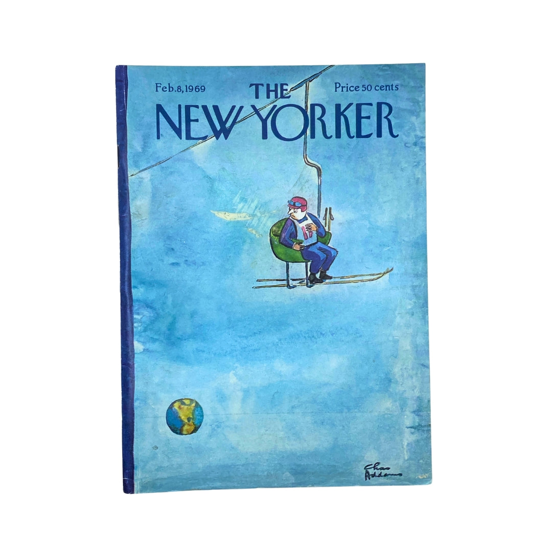 The New Yorker Complete Magazine February 8, 1969, featuring a Chas Addams' cover illustration of a man reading on a ski lift against a blue background.