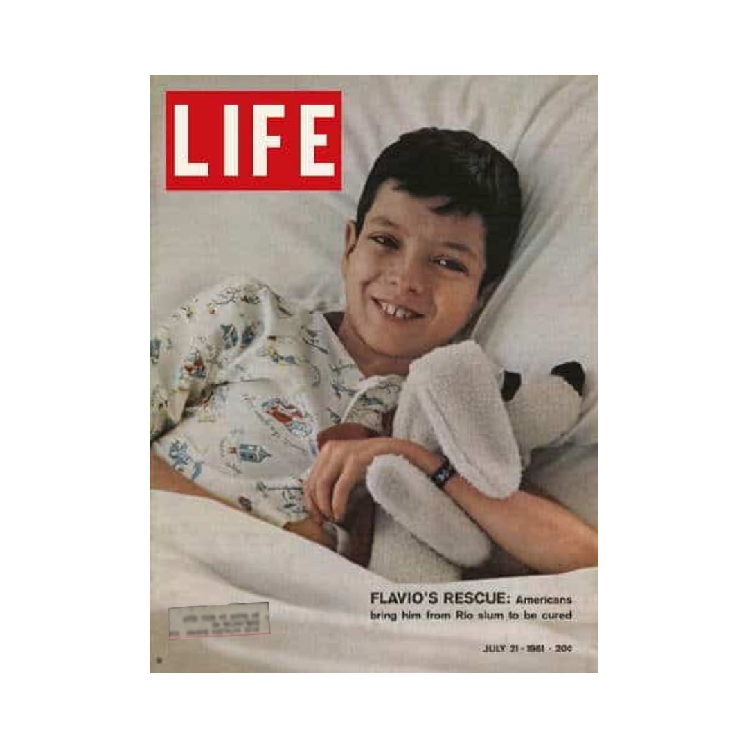 Cover of Life Magazine dated July 21, 1961 featuring Flavio, a young boy with a smile, holding a stuffed animal, representing his story of rescue from the Rio slum.
