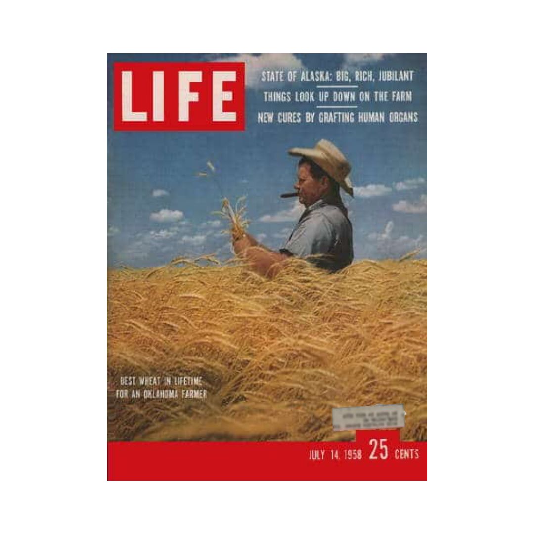 Vintage Life Magazine cover from July 14, 1958, featuring an Oklahoma farmer, Krigbaum, amidst fields of wheat, highlighting agricultural prosperity and historical significance.