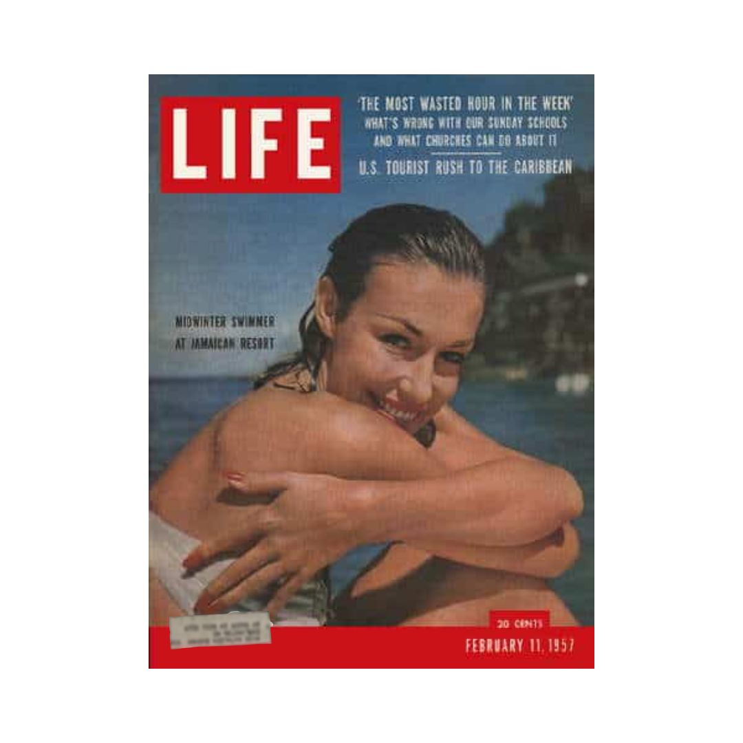 Cover of Life Magazine from February 11, 1957, featuring a midwinter swimmer at a Jamaican resort. The magazine highlights the surge of U.S. tourists to the Caribbean, with vibrant imagery and engaging articles reflecting the culture and events of 1957.