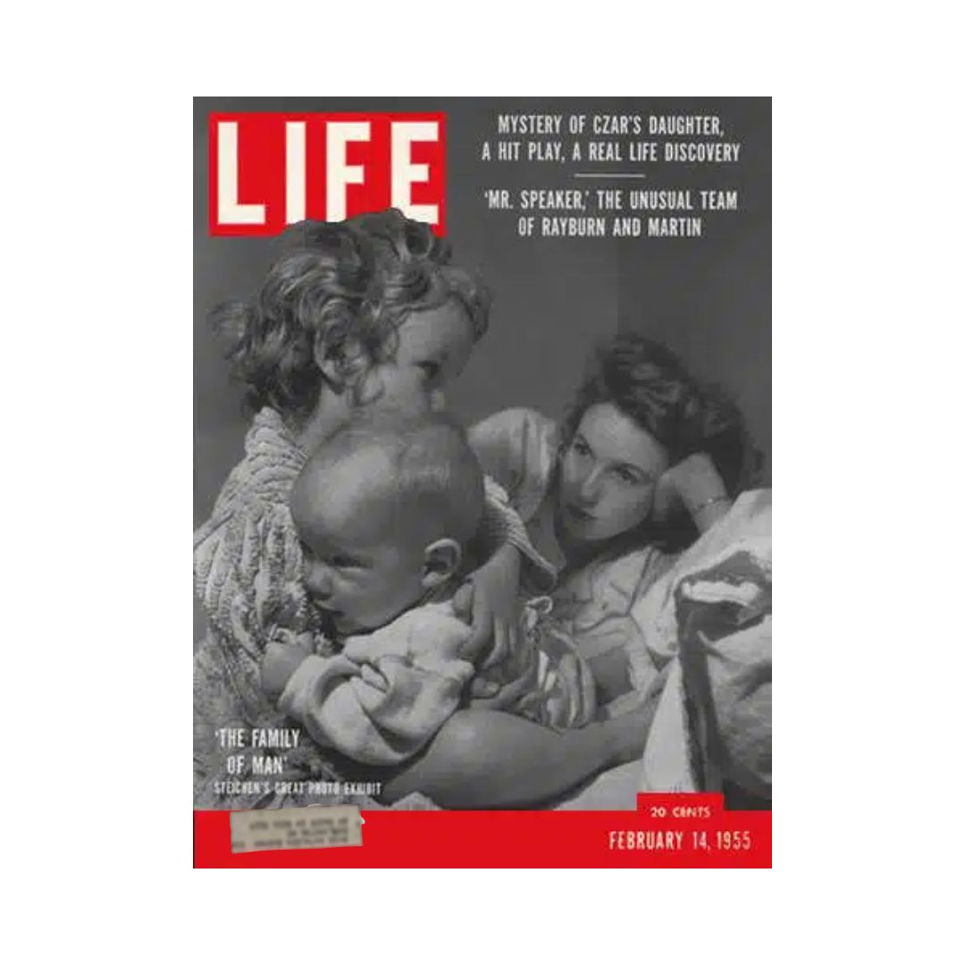 Cover of the vintage Life magazine dated February 14, 1955, featuring the title 'The Family of Man'. The cover includes a captivating image of a mother and children, with a bold red header displaying 'LIFE' and highlights on topics like the mystery of Czar's daughter.