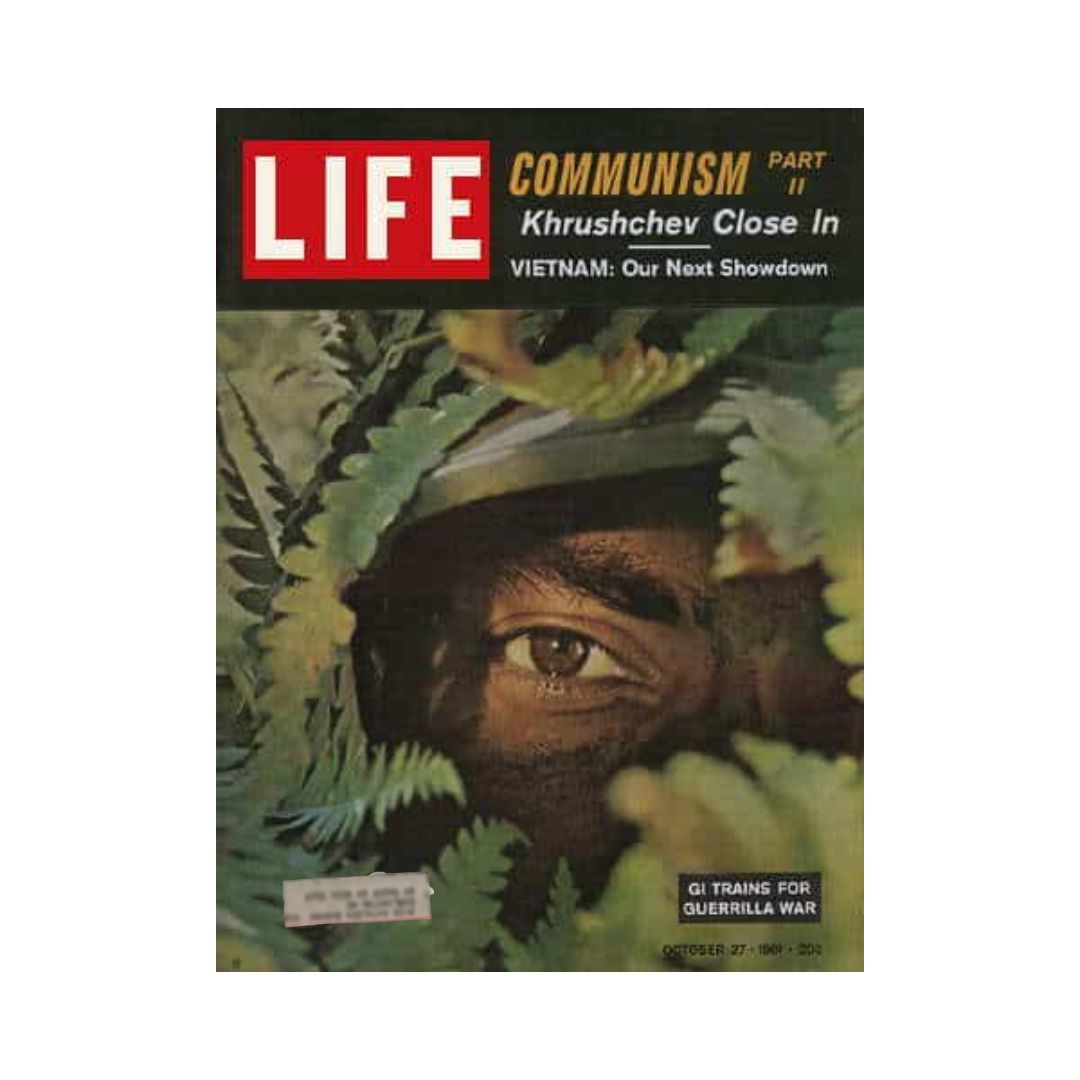 Cover of Life Magazine dated October 27, 1961 featuring the title 'G.I. Trains for Guerrilla War in Vietnam'. The image shows a soldier's eye peering through foliage, symbolizing military strategies during the Vietnam War.