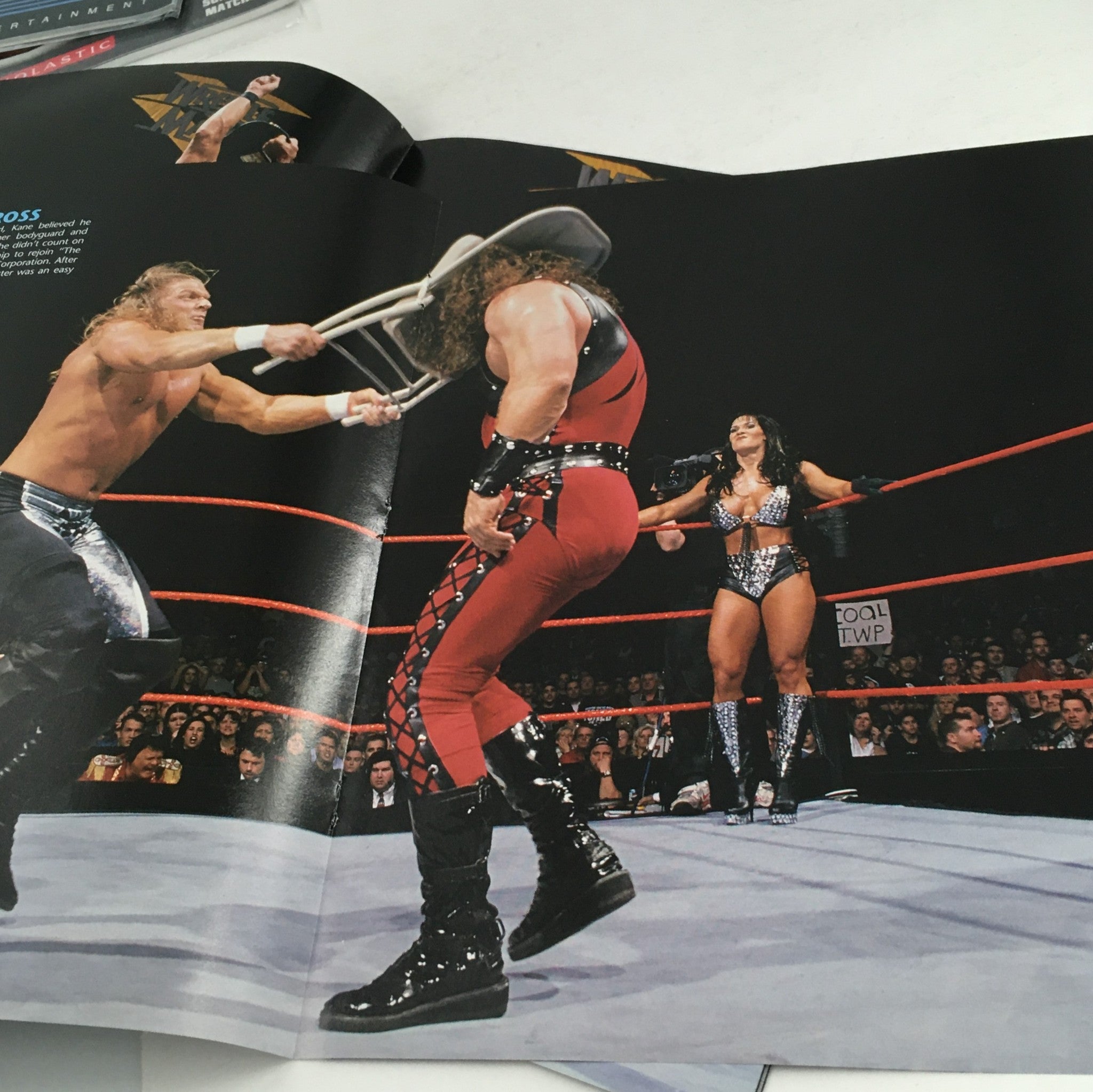 WWE Wrestle Mania May 30 2005 Photo Collection Vol. 2 capturing a vibrant wrestling match scene with wrestlers in action, highlighting the excitement of WrestleMania.