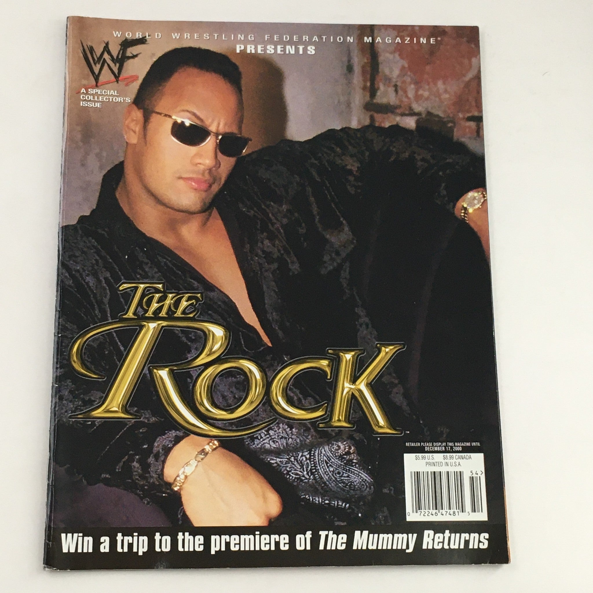 WWF Magazine December 2000 featuring Dwayne 'The Rock' Johnson on the cover, showcasing his iconic look with sunglasses.