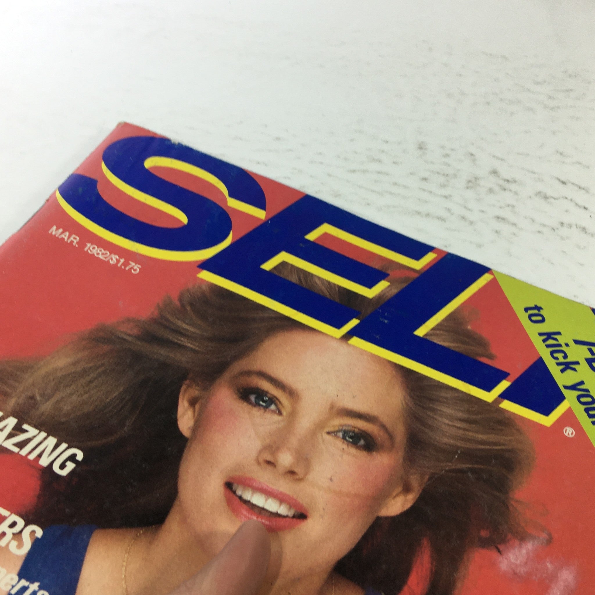 Detailed shot of VTG Self Magazine: March 1982 cover showing Kelly Emberg's smiling face, with keywords about diet, beauty tips, and wellness prominently featured.