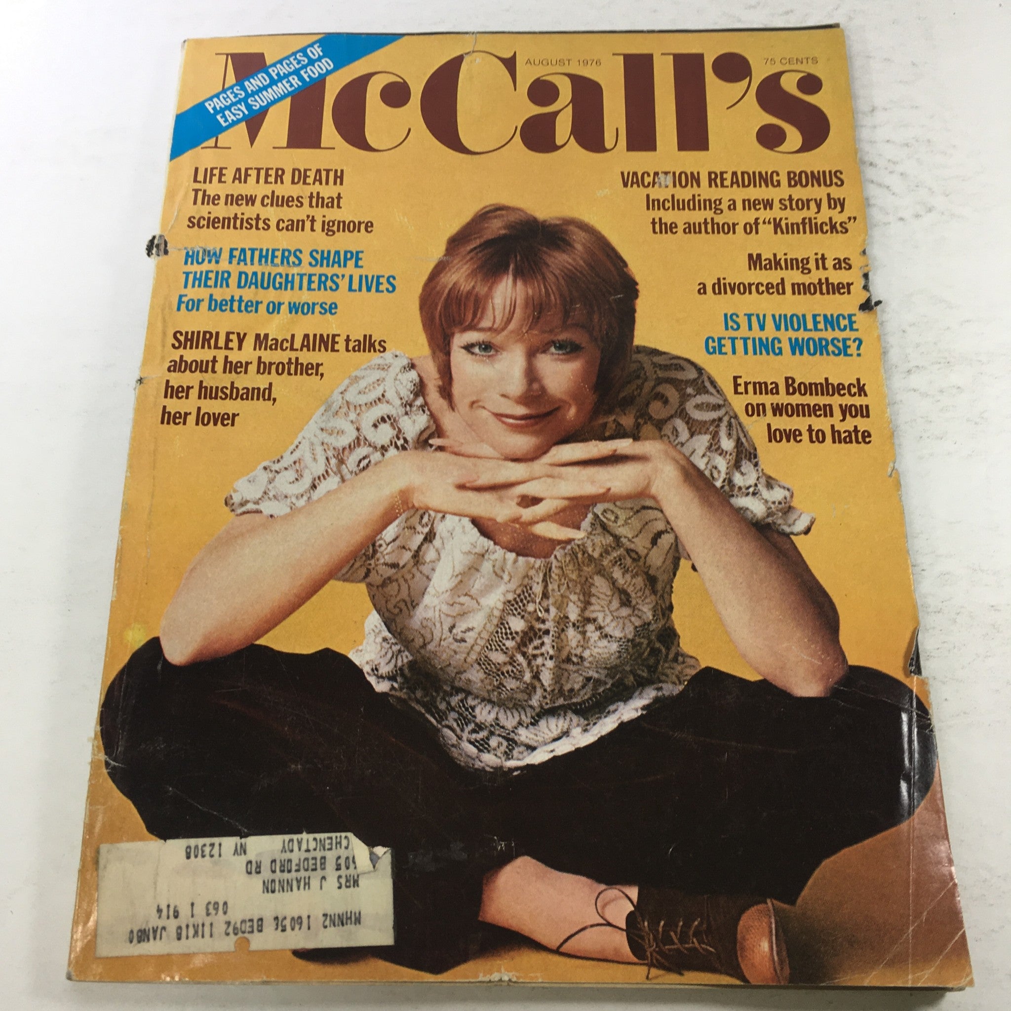 VTG McCall's Magazine Cover - August 1976 featuring Shirley MacLaine, showcasing a vintage design with cultural references and article highlights.