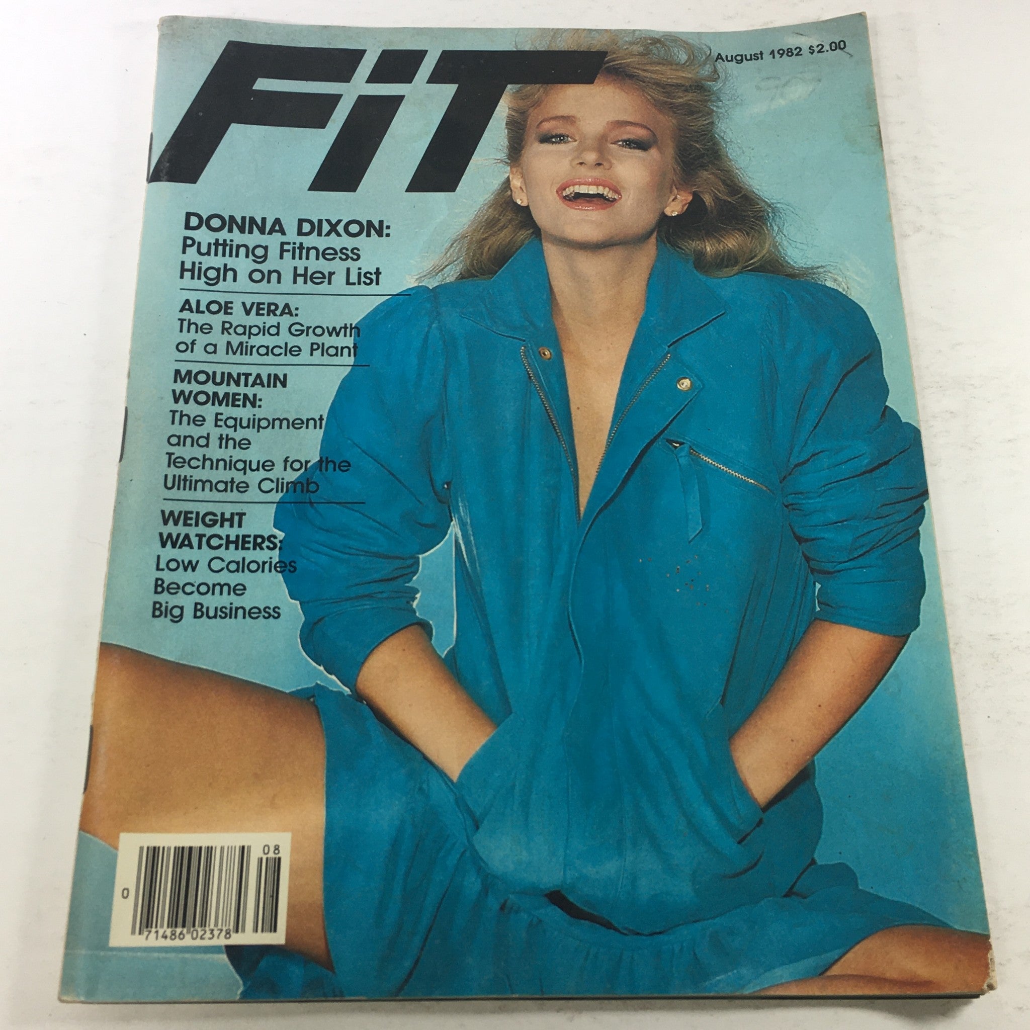 VTG Fit Magazine: August 1982 featuring Donna Dixon on the cover, showcasing her in a stylish blue outfit with fitness-related headlines.