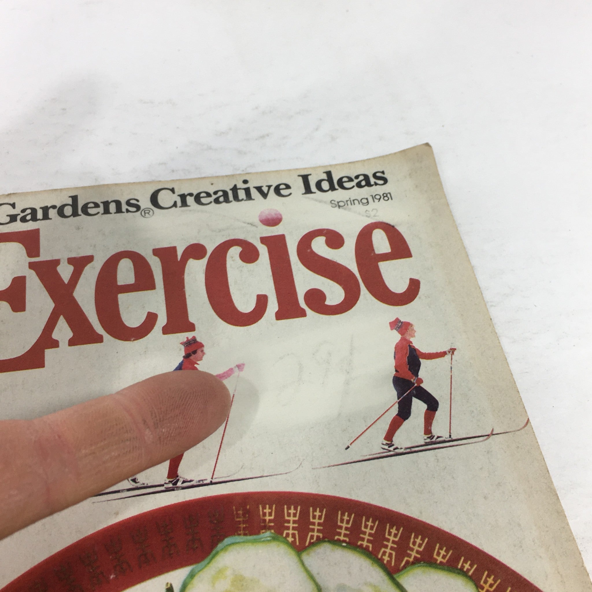 Close-up of the VTG Diet & Exercise Magazine, Spring 1981 - Feeling Fit and Loving It Issue cover, featuring a skier and a hand pointing to the title 'Exercise'.