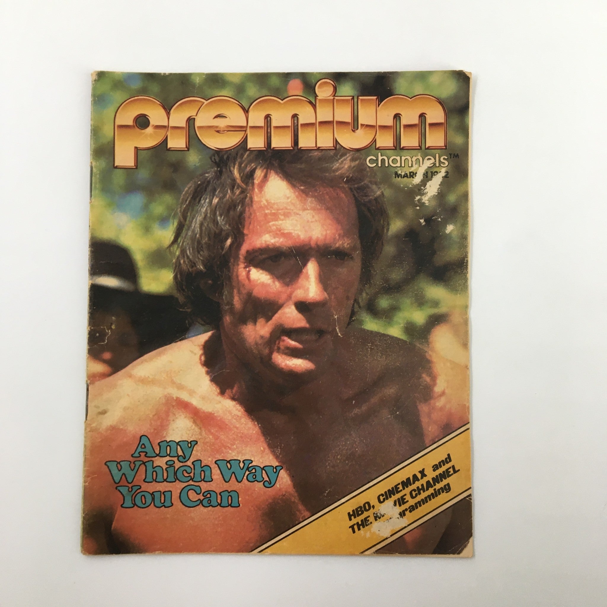 Vintage Premium Channels Mini Magazine March 1982 featuring Clint Eastwood on the cover, showcasing the movie 'Any Which Way You Can'. The magazine has visible wear indicative of its vintage nature and measures 5" x 6", encapsulating pop culture from the early 1980s.