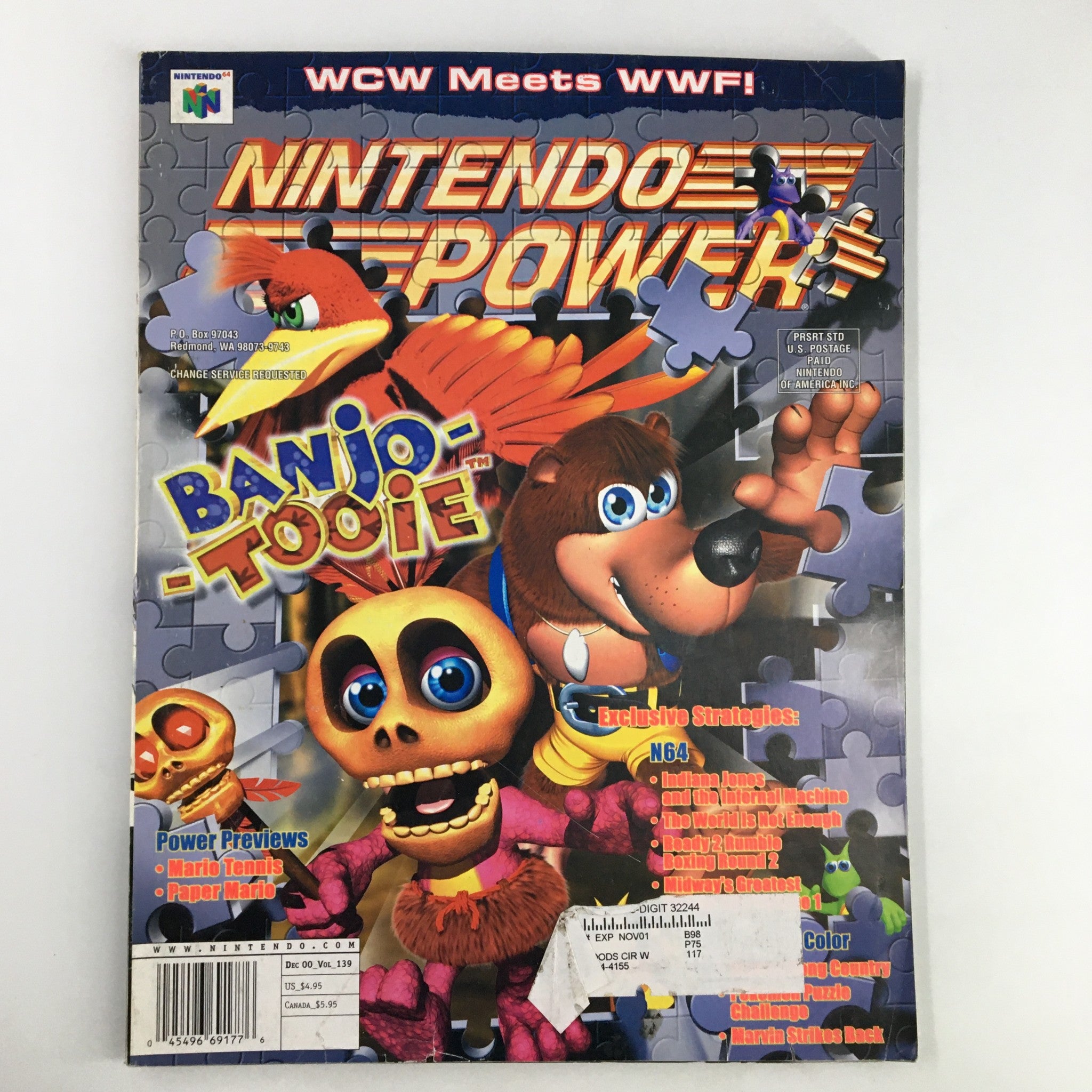 Cover of Nintendo Power Magazine Vol 139 December 2000 featuring Banjo Tooie and WCW Meets WWF, showcasing vibrant graphics and collectible details.