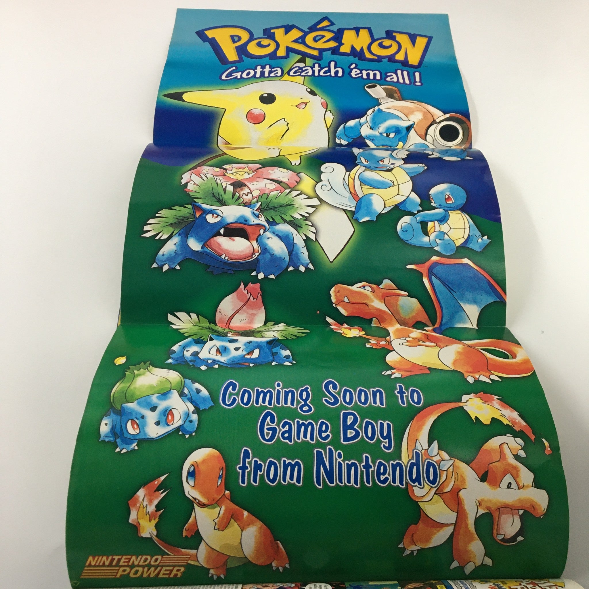 Folded poster featuring various Pokémon characters, promoting upcoming Game Boy games, featured within Nintendo Power Magazine #111.