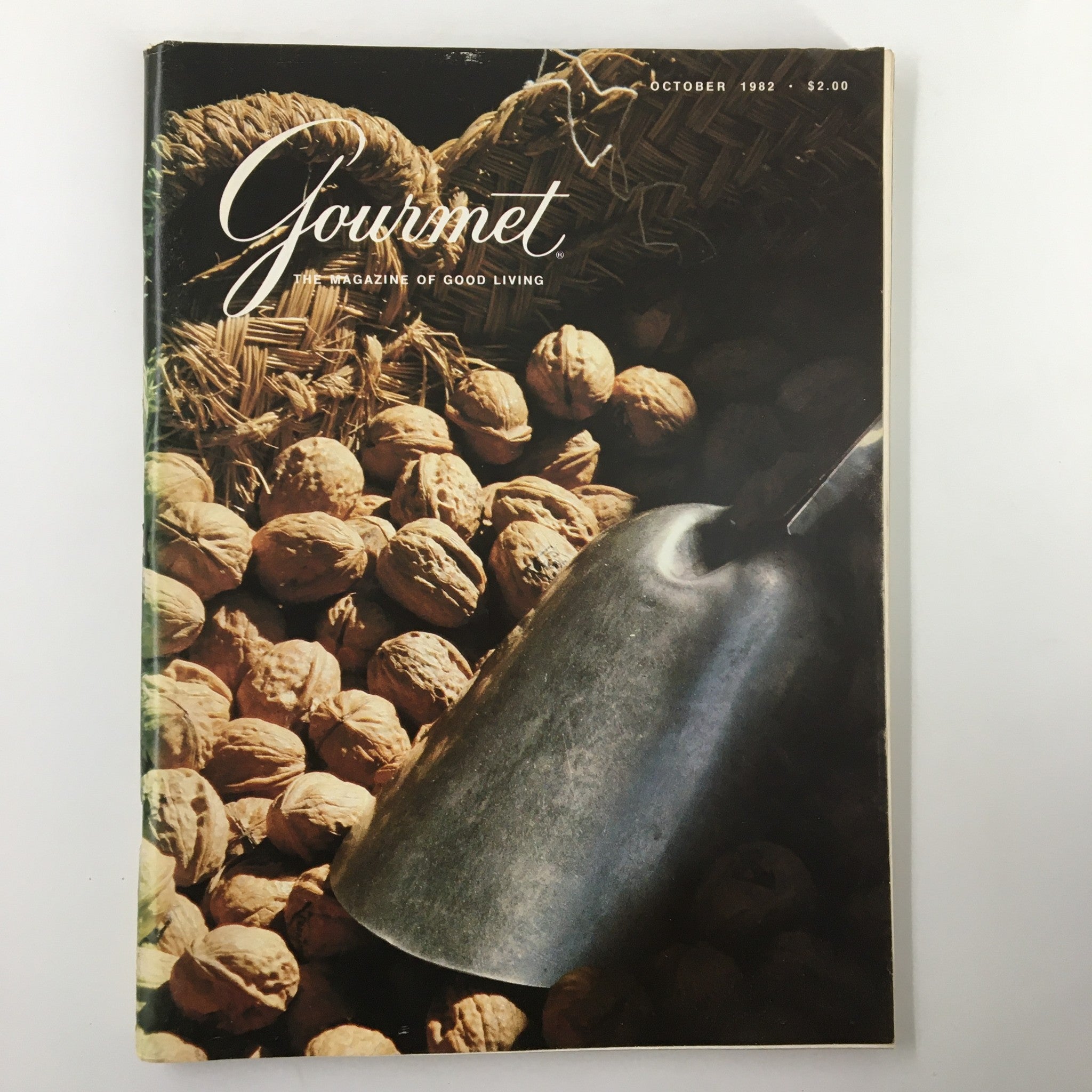 Cover of VTG Gourmet Magazine October 1982 featuring walnuts and a scoop, showcasing the magazine's theme of culinary exploration.