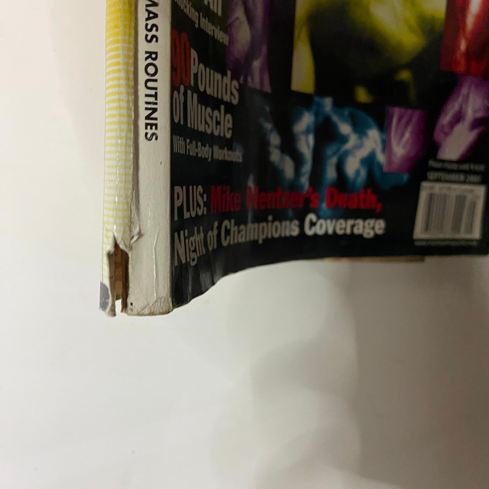 Close-up view of the spine of Iron Man Magazine September 2001, showing slight wear and tear, emphasizing its status as a collectible item with historical significance in fitness and bodybuilding.