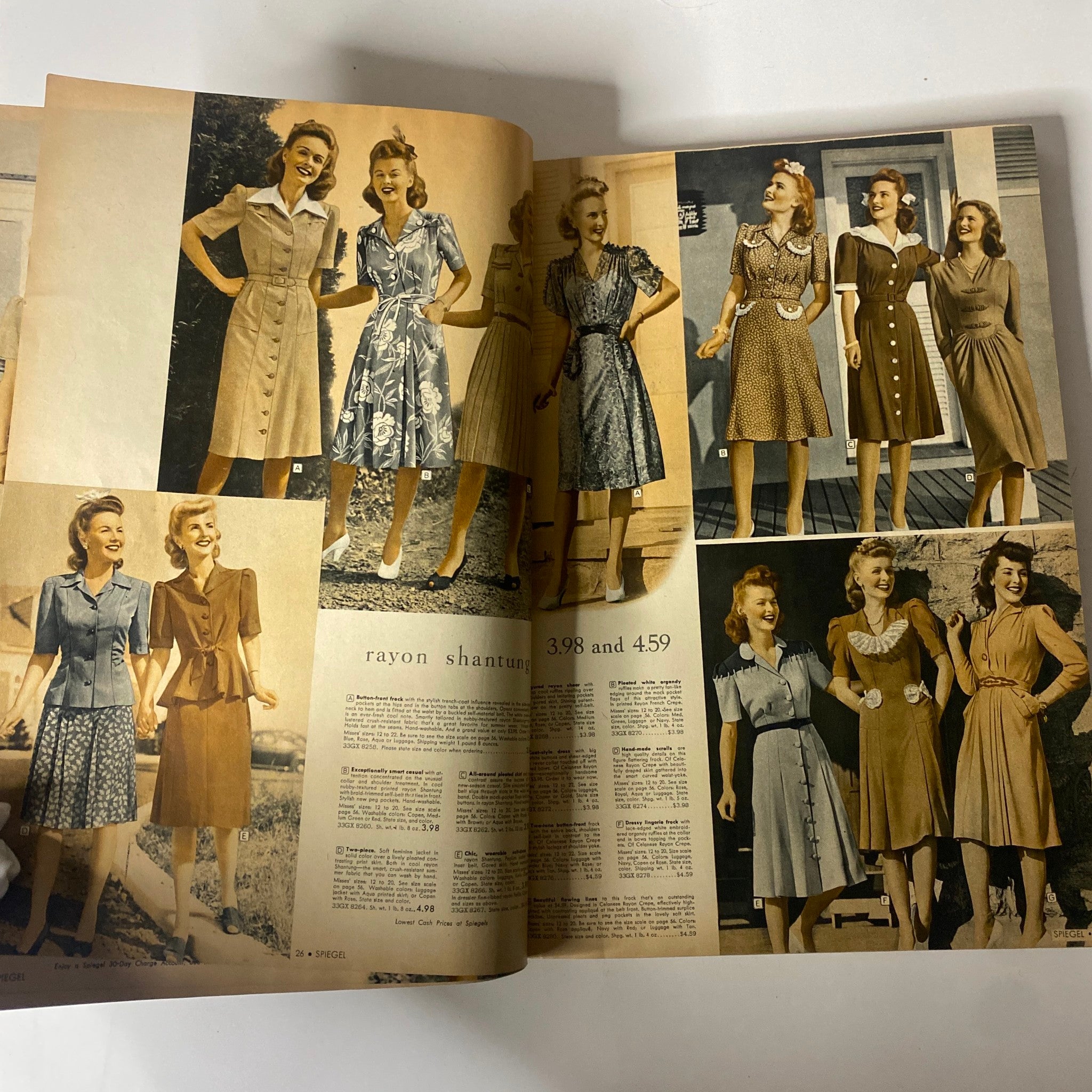 Interior pages of the 1943 Spiegel Spring and Summer Catalog presenting various fashionable dresses, illustrating casual and formal styles of the era.