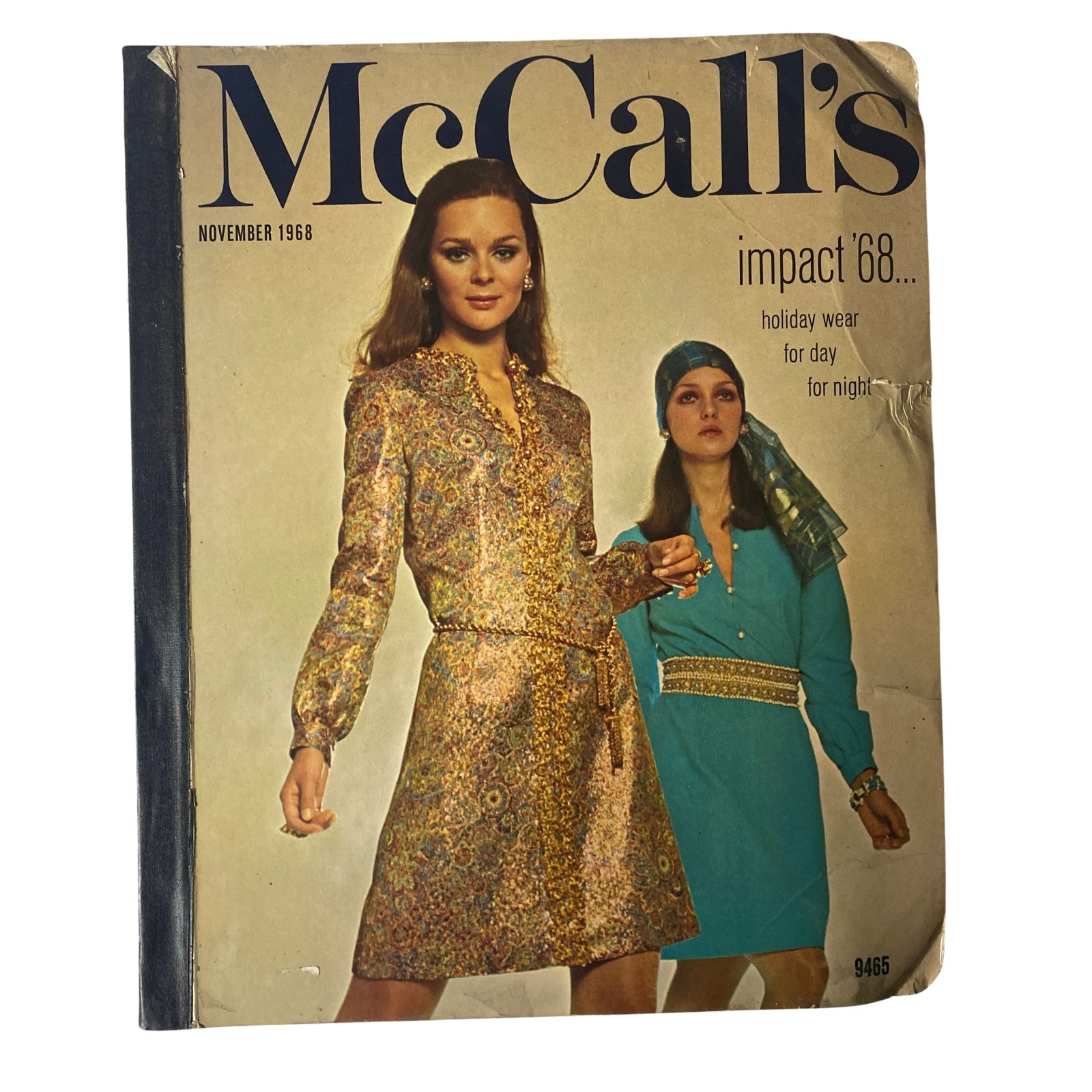1968 November McCall's Holiday Wear Catalog cover featuring two women modeling vibrant holiday outfits, showcasing fashion trends for both day and night wear.