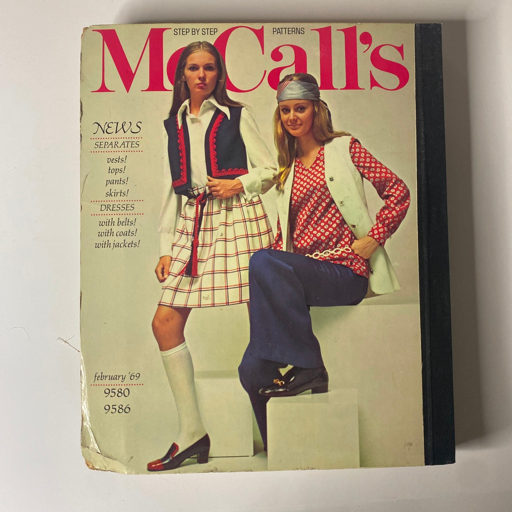 1969 February McCall's Step by Step Patterns Catalog featuring fashionable women in stylish outfits including vests, skirts, and dresses, highlighting sewing patterns and details.