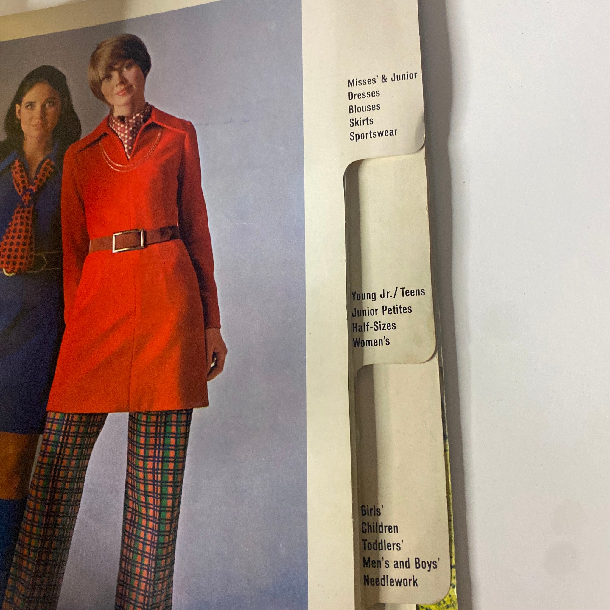 Close-up of an interior page from the 1969 McCall's School Fall Catalog, displaying various clothing options including misses' and juniors' styles.