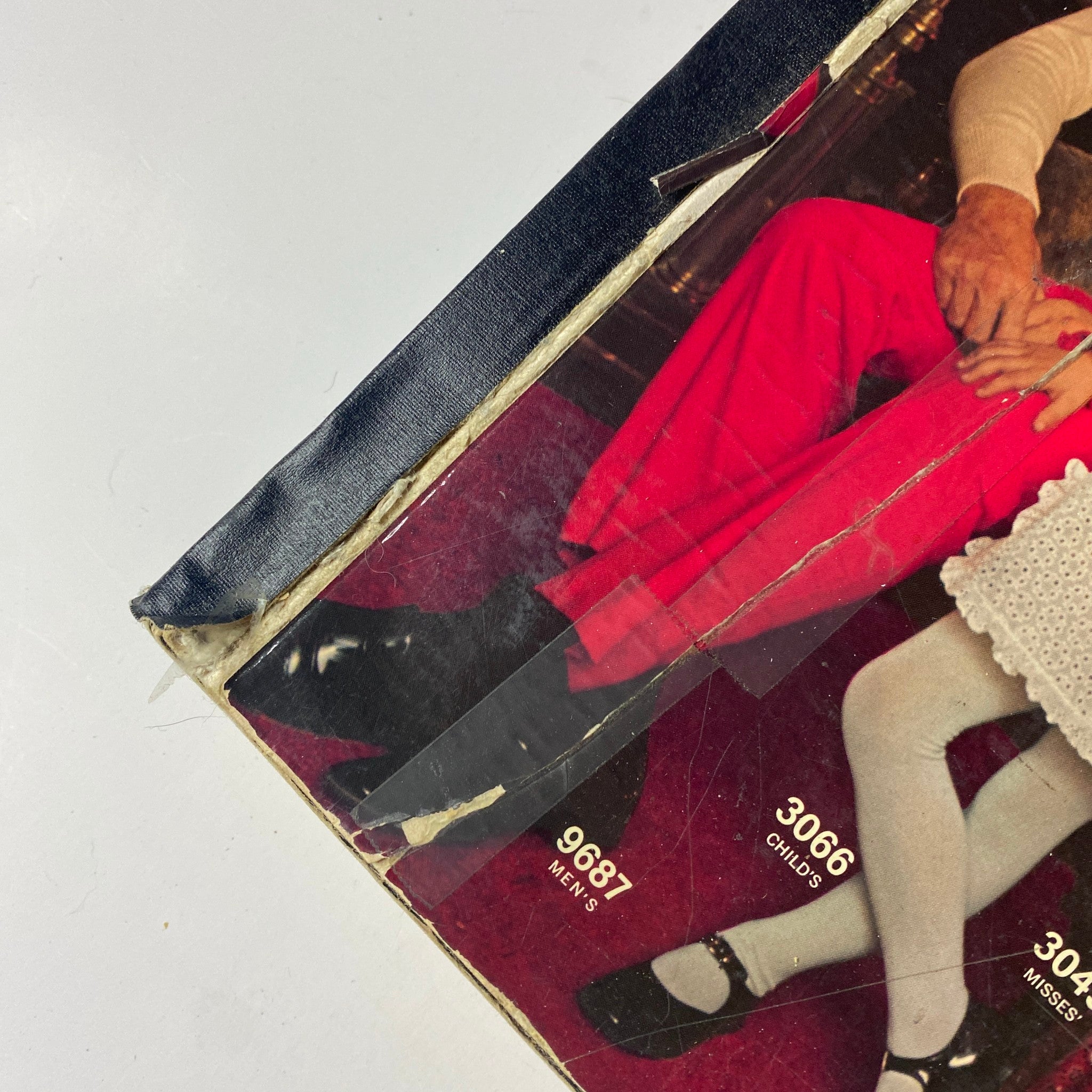 Close-up of the 1971 McCall's Christmas Holiday Issue cover highlighting the men's outfit styles, with printed clothing patterns visible.