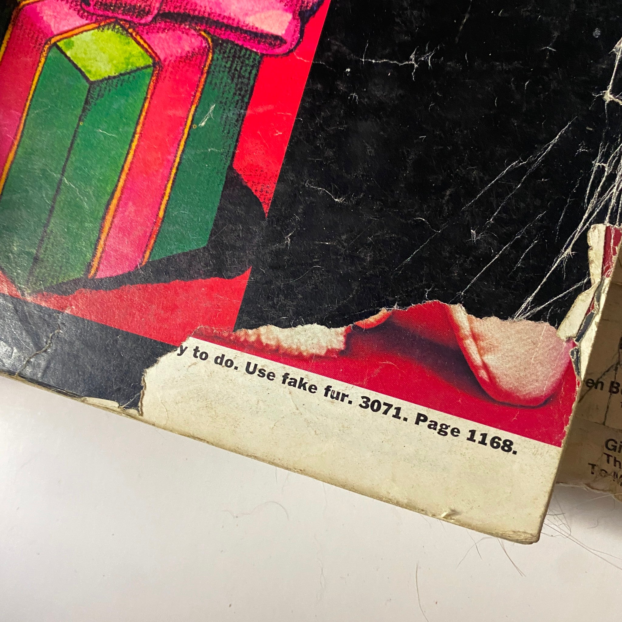 Detail of the back cover of the 1971 McCall's Christmas Holiday Issue showcasing colorful gift illustrations and vintage fabric suggestions.