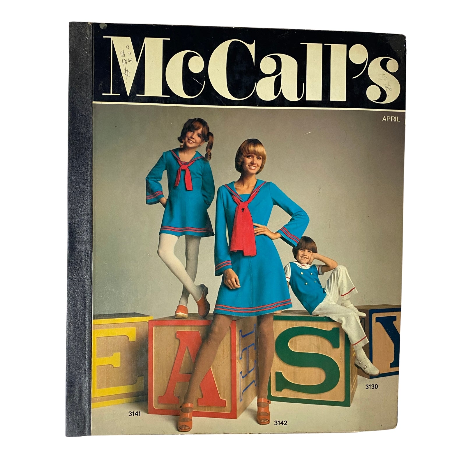 Cover of the 1972 April McCall's Catalog featuring children and a woman modeling colorful sewing patterns. The title 'McCall's' prominently displayed, showcasing fashion inspiration from the early 1970s.
