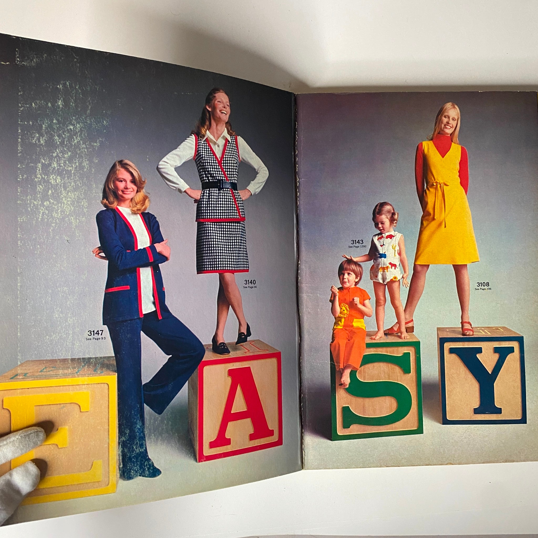 Inside pages of the 1972 April McCall's Catalog displaying models in stylish clothing designs, including a variety of patterns for women and children. This rich visual content reflects the DIY fashion trends of the 1970s.
