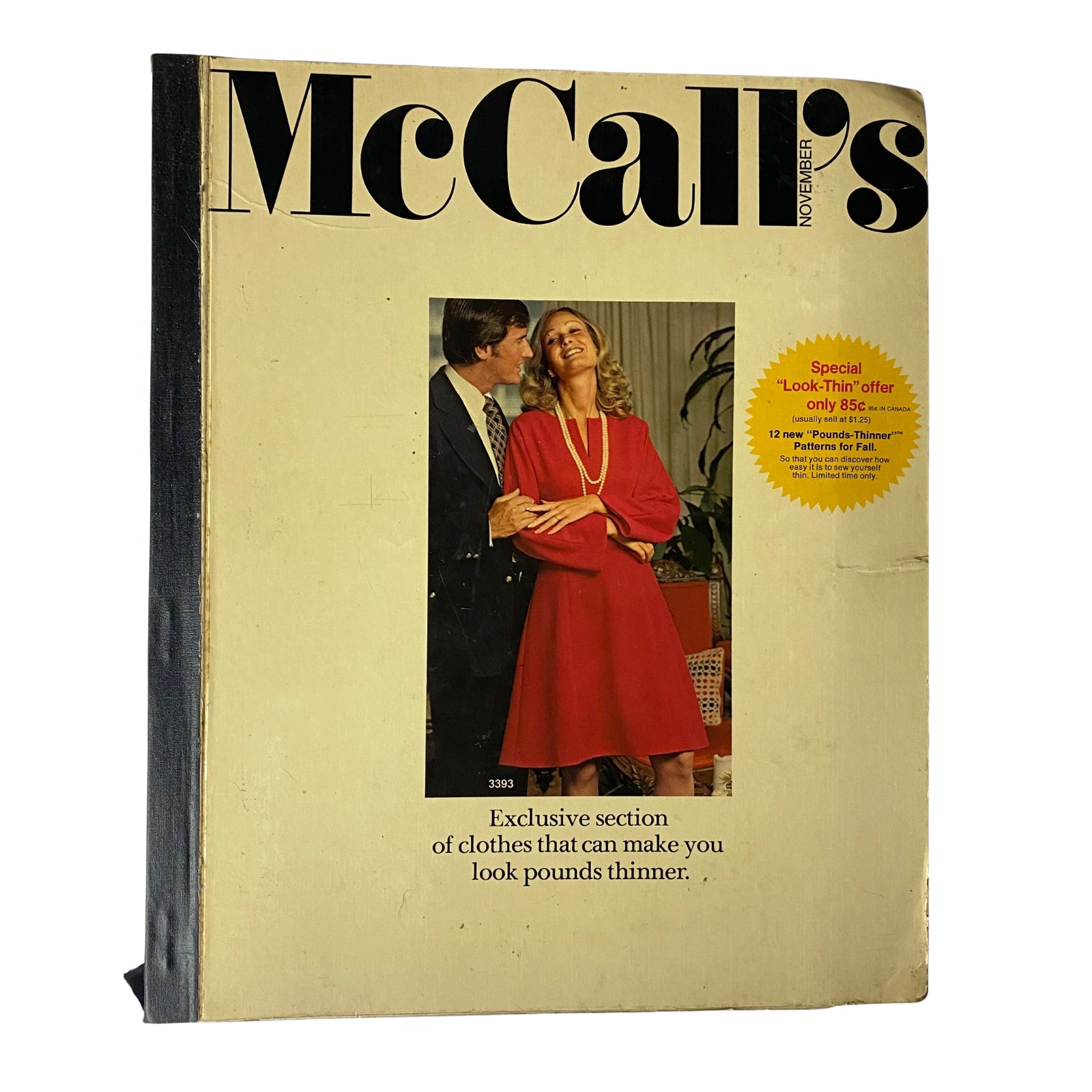 1972 November McCall's Catalog cover featuring a fashion couple, showcasing a stylish red dress and promotional text about 'Look-Thin' offers.