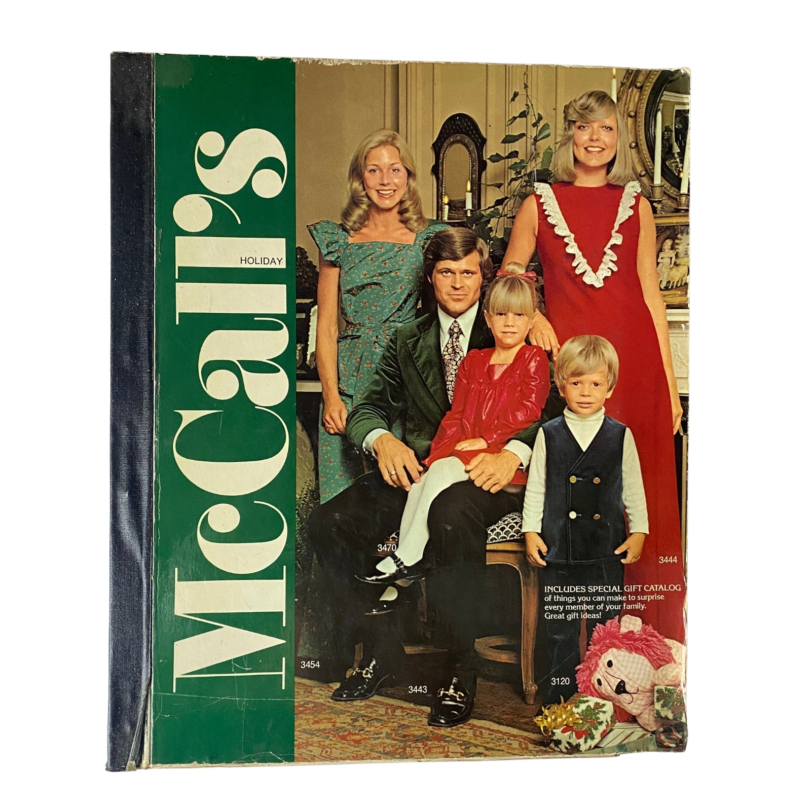 1972 McCall's Holiday Huge Store Retail Counter Catalog cover featuring a family in vintage outfits, showcasing festive holiday fashion.