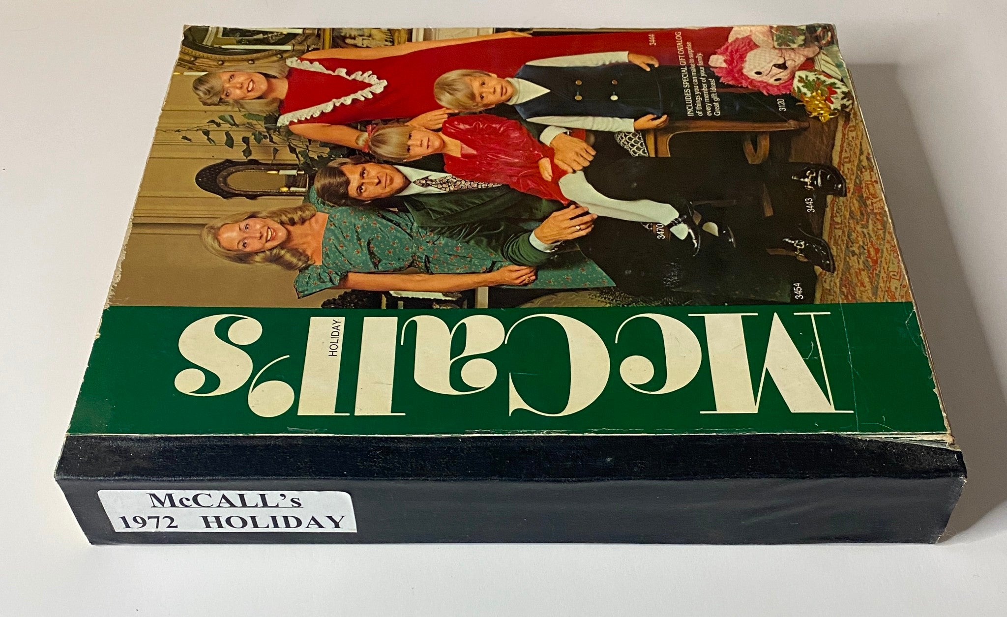 Side view of the 1972 McCall's Holiday Huge Store Retail Counter Catalog, emphasizing the classic design and holiday theme.