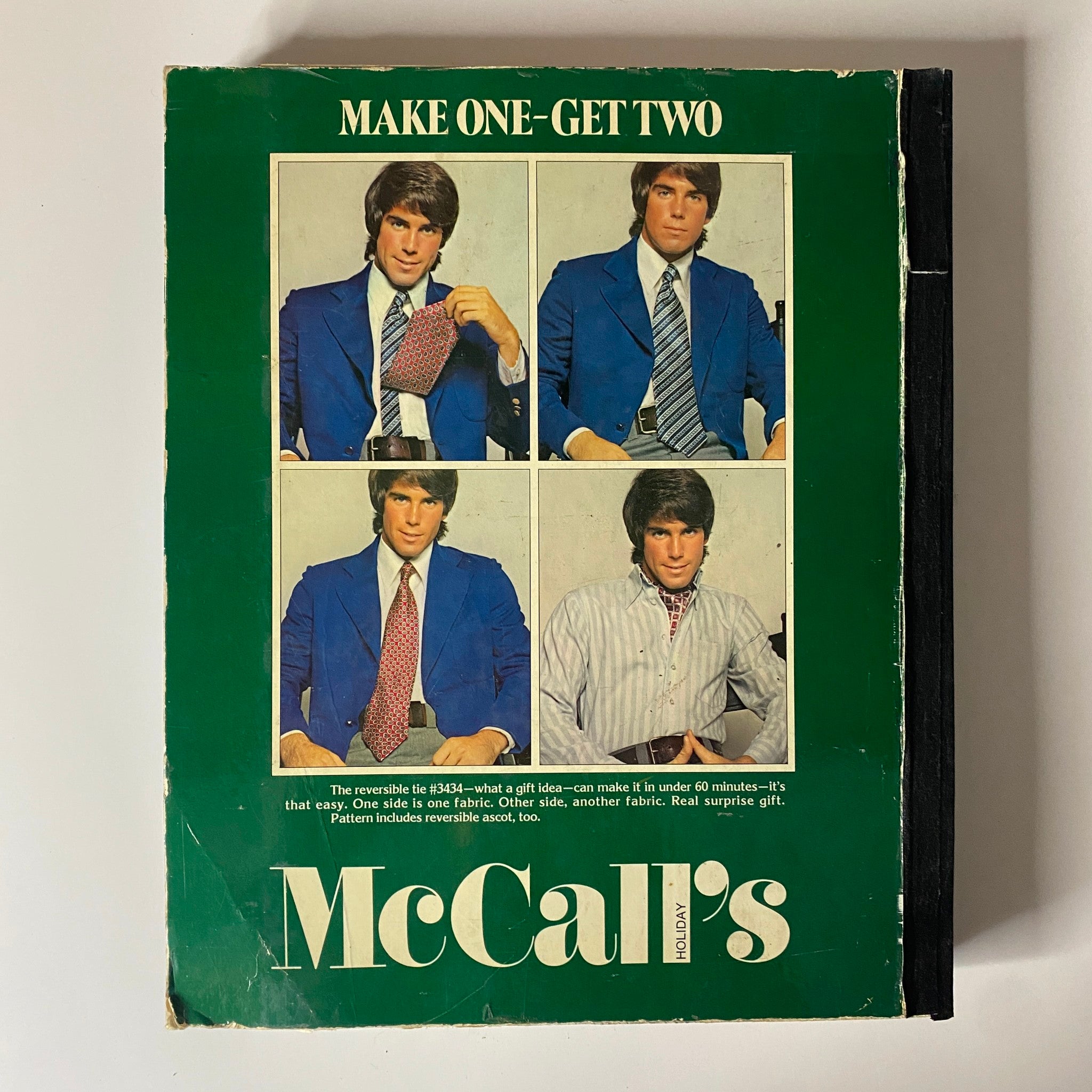 1972 McCall's Holiday Huge Store Retail Counter Catalog displaying a vintage sewing book cover with stylish male models showcasing reversible tie designs.
