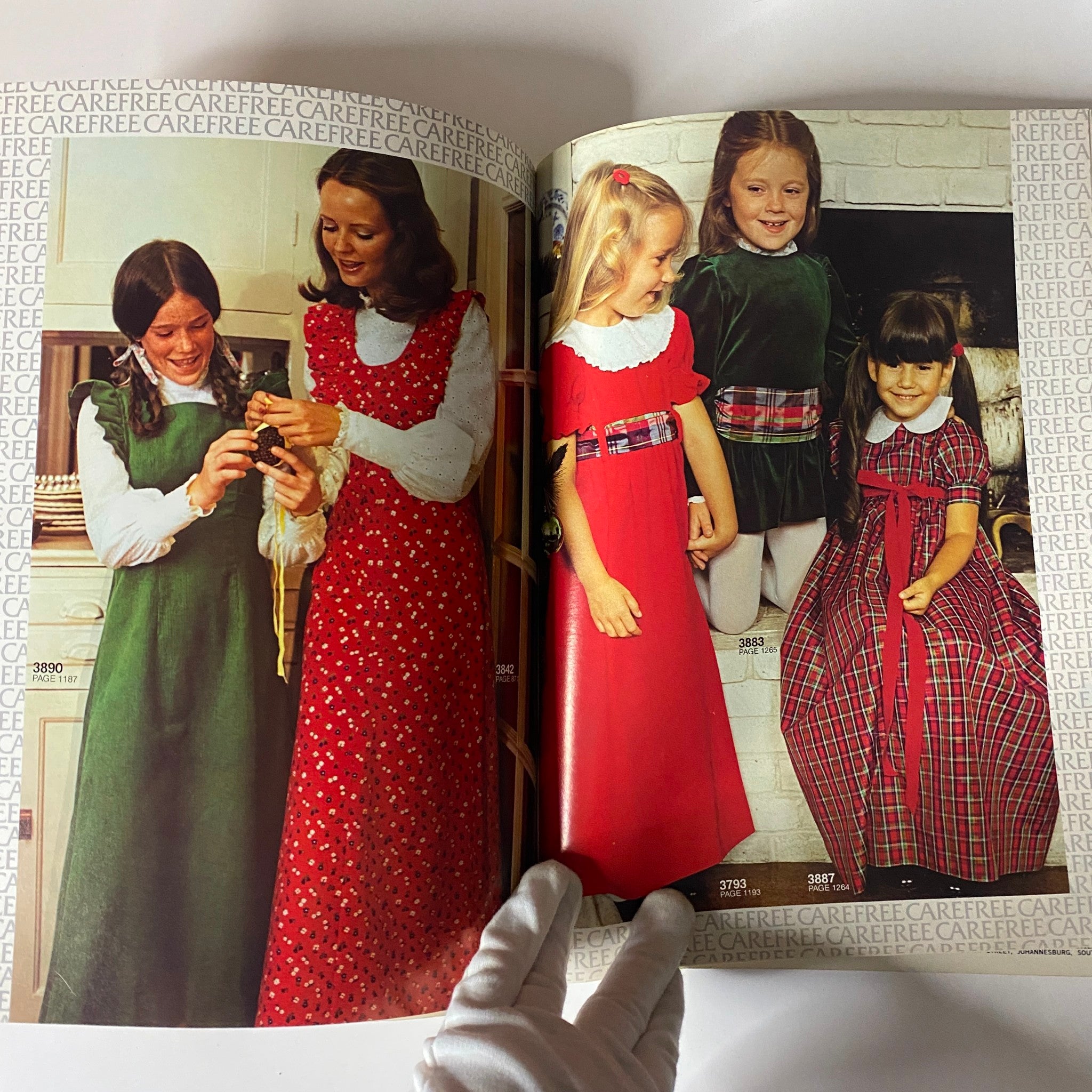 1973 January Carefree McCall's Huge Store Retail Counter Catalog showcasing vintage children's fashion with colorful dresses, skirts, and styles from the 1970s. Featuring women and girls in fashionable outfits, emphasizing ease of sewing and stylish designs.