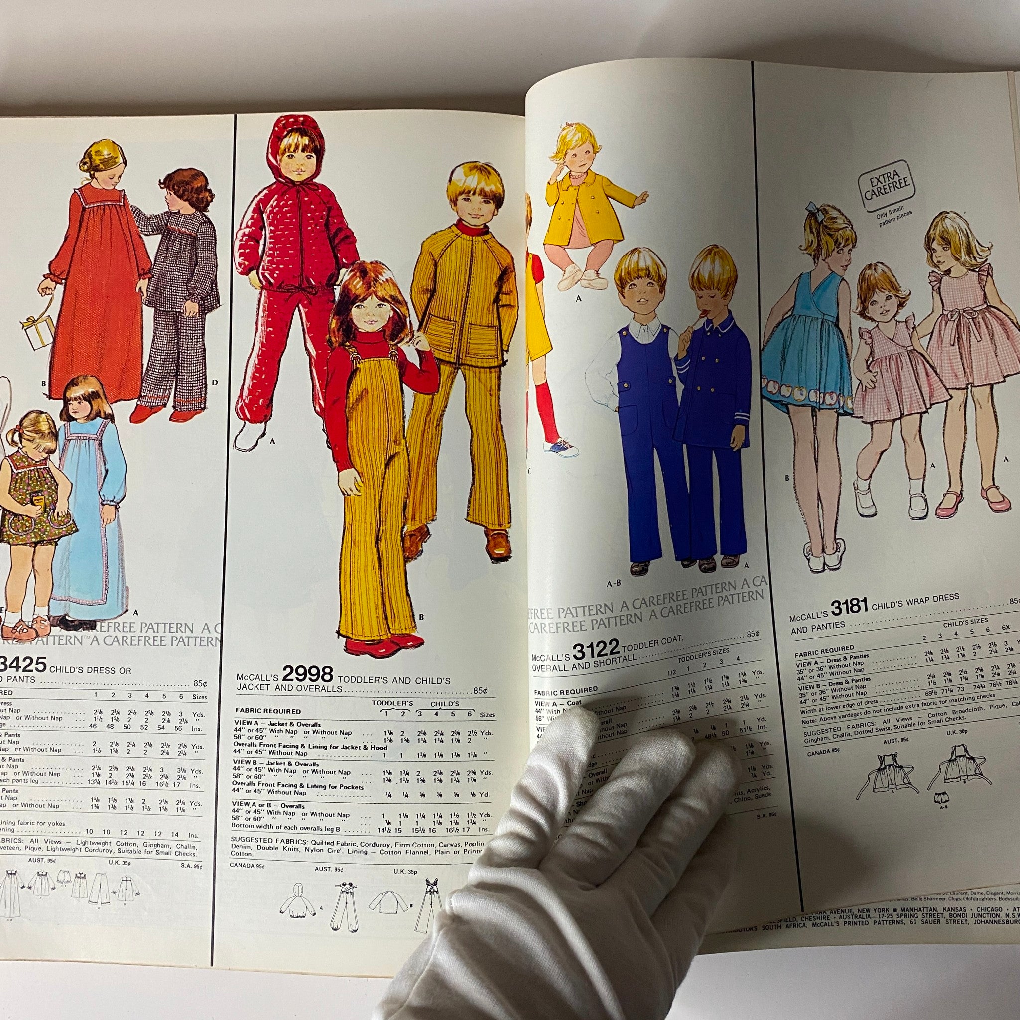 1973 January Carefree McCall's Huge Store Retail Counter Catalog displaying vintage designs for children's clothing patterns including overalls, dresses, and smart casual wear suitable for toddlers and kids.