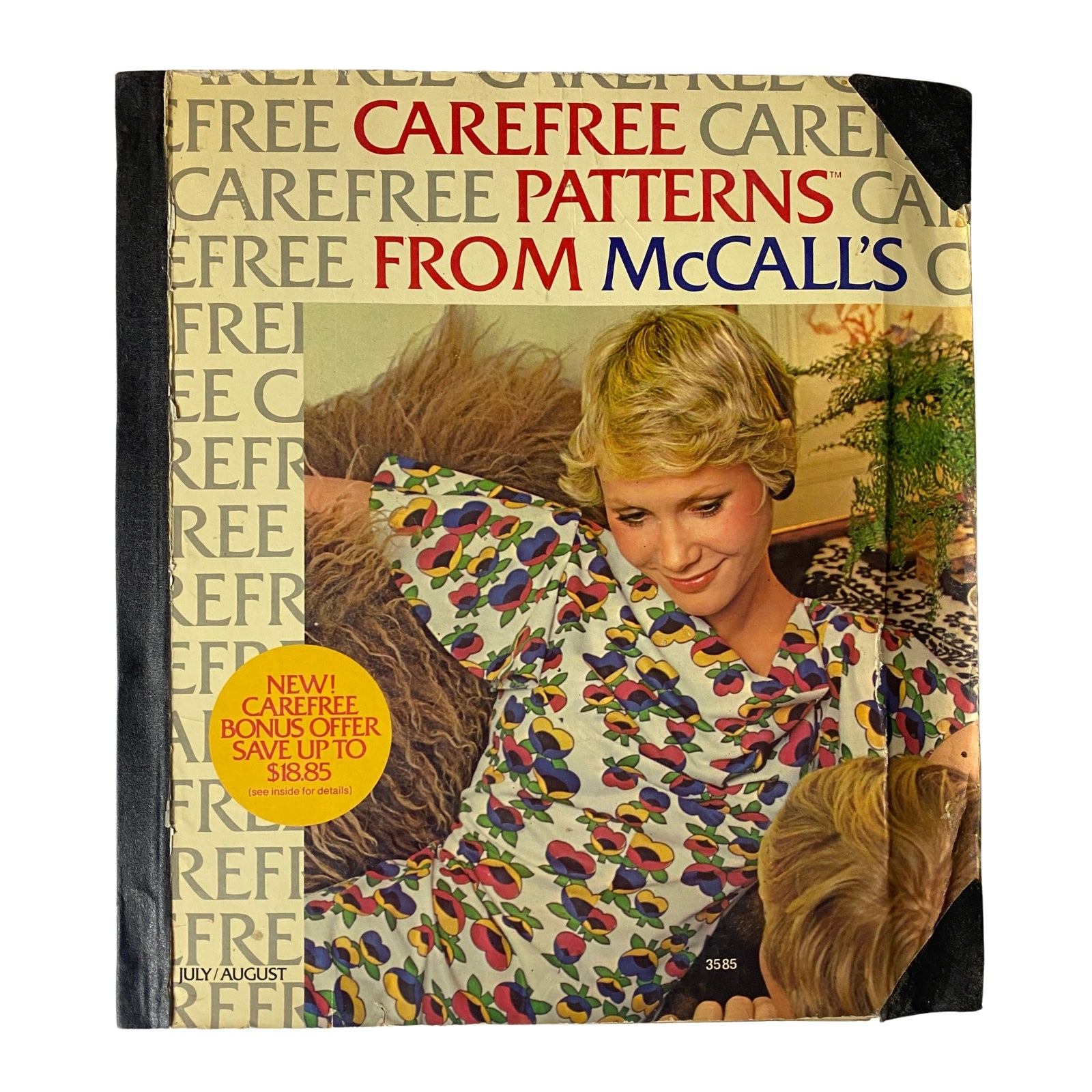 Cover of the 1973 July - August McCall's Carefree Patterns Catalog featuring a woman in a colorful dress with a casual hairstyle, showcasing the brand's signature carefree sewing patterns.