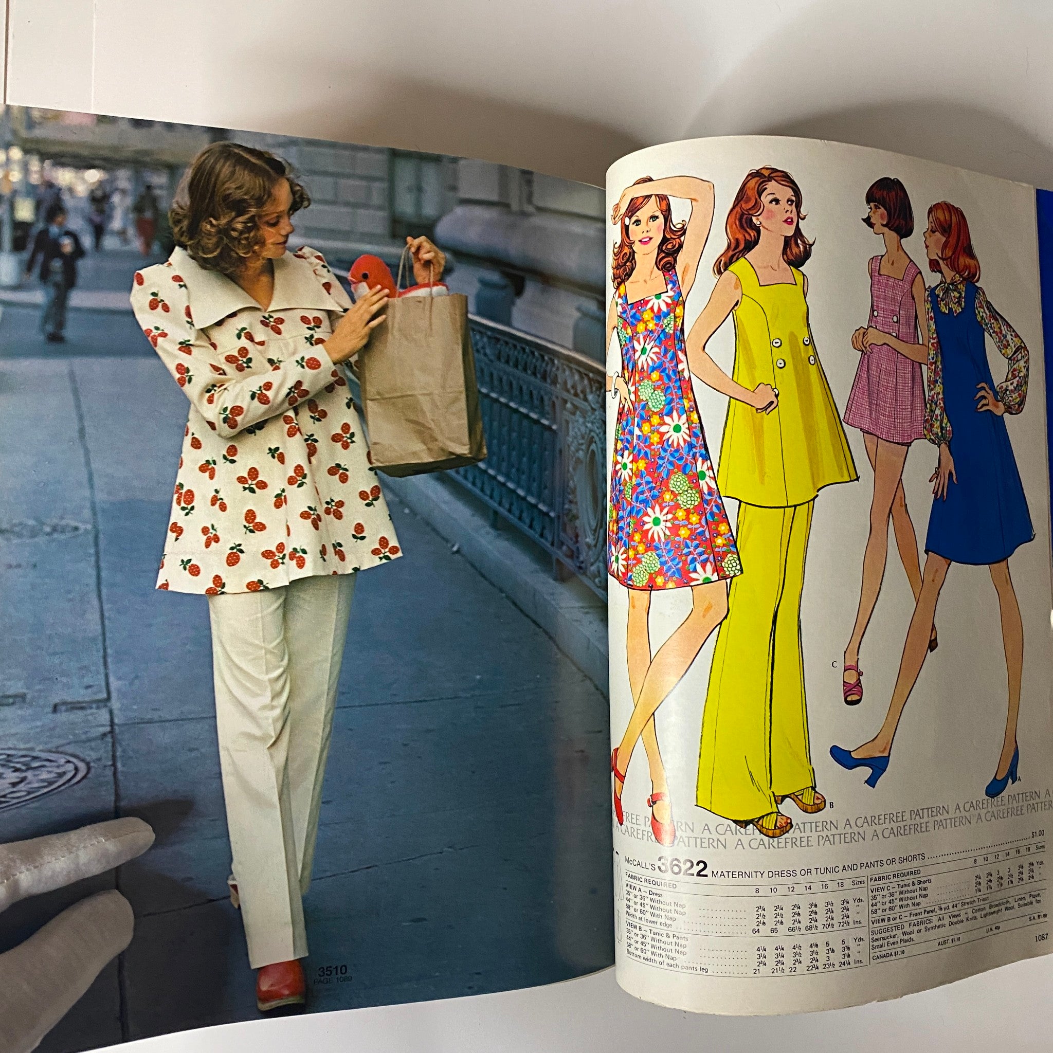 1973 July - August McCall's Carefree Patterns Catalog displaying a model wearing a floral patterned tunic in a city setting, alongside colorful clothing illustrations.