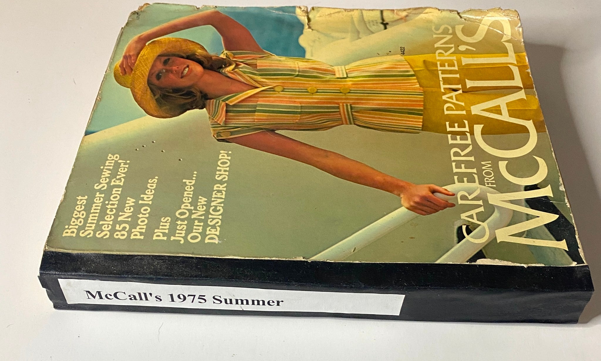 Side view of the 1975 Carefree Patterns McCall's Summer Catalog showcasing the model in a vibrant outfit, highlighting summer sewing selections for enthusiasts.