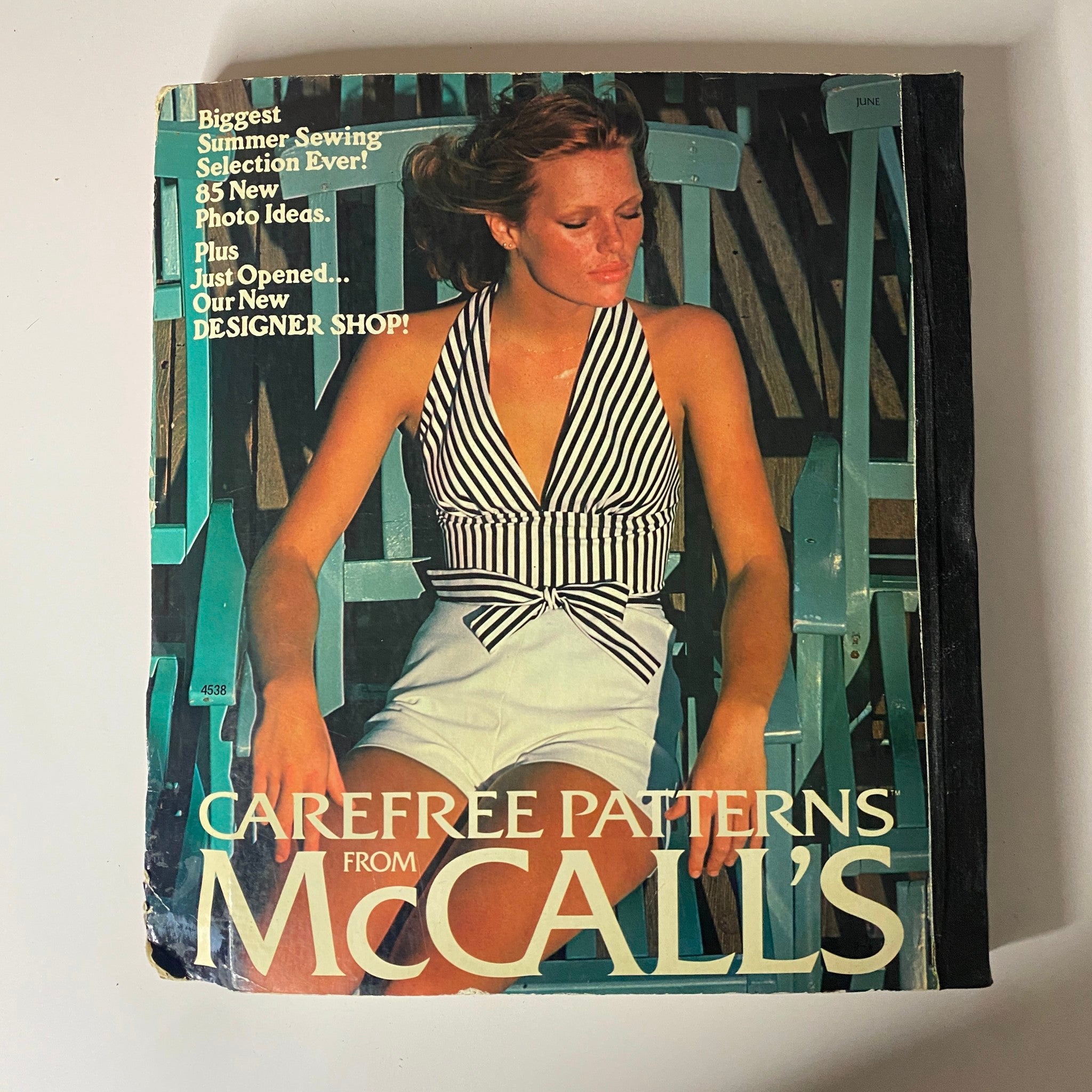1975 June Carefree Patterns McCall's Catalog cover featuring a model in a stylish striped halter top and shorts, emphasizing summer fashion.