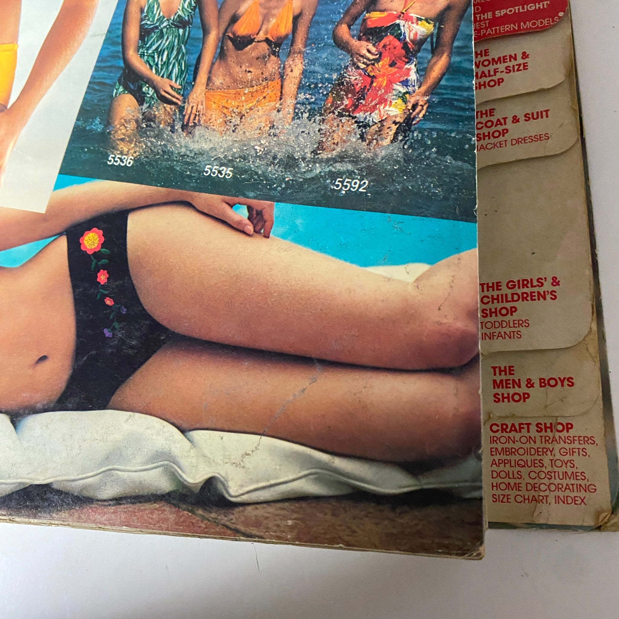 Close-up of the 1977 July Carefree Patterns McCall's Summer Catalog showing several swimsuit designs, capturing the relaxed and vibrant spirit of 1970s summer fashion.