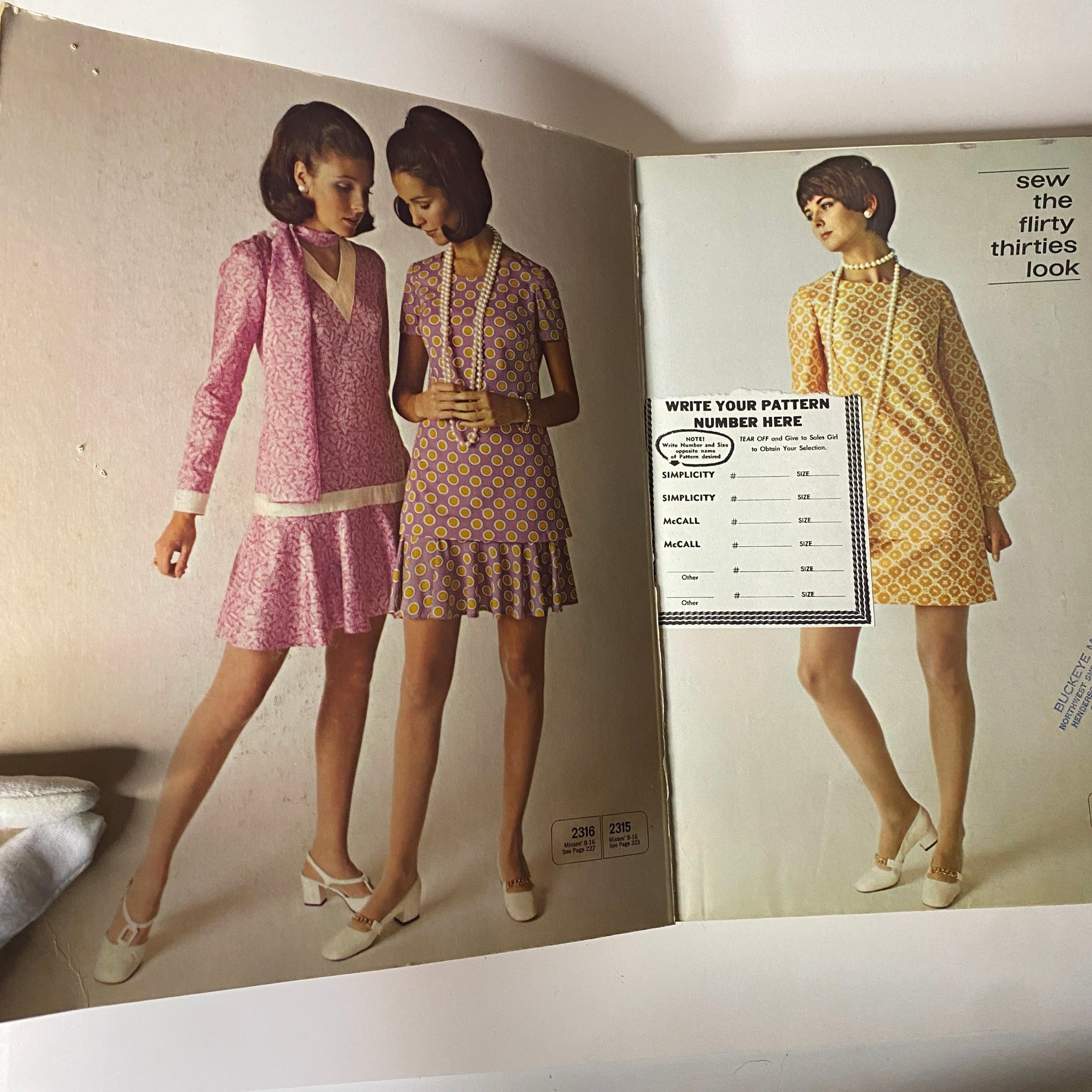 Interior page of the 1960s April McCall's Step-by-Step Pattern Catalog displaying illustrated patterns and fashion options for sewing.