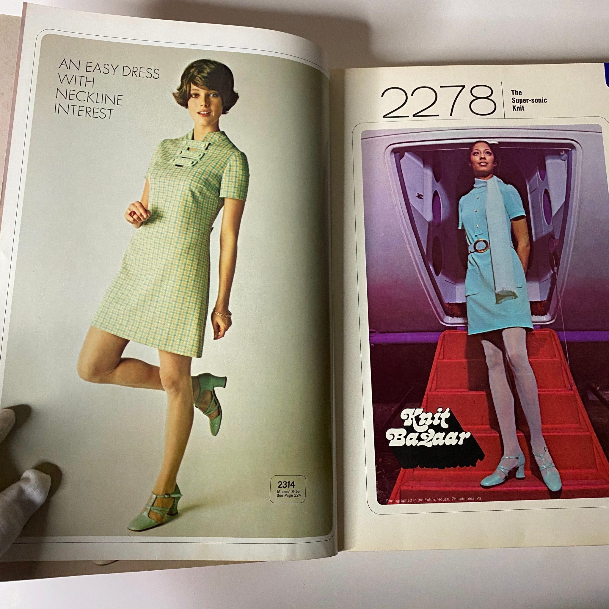 1960s April McCall's Step-by-Step Pattern Catalog featuring a model wearing a short green checkered dress with neckline interest, showcasing a stylish retro fashion look.
