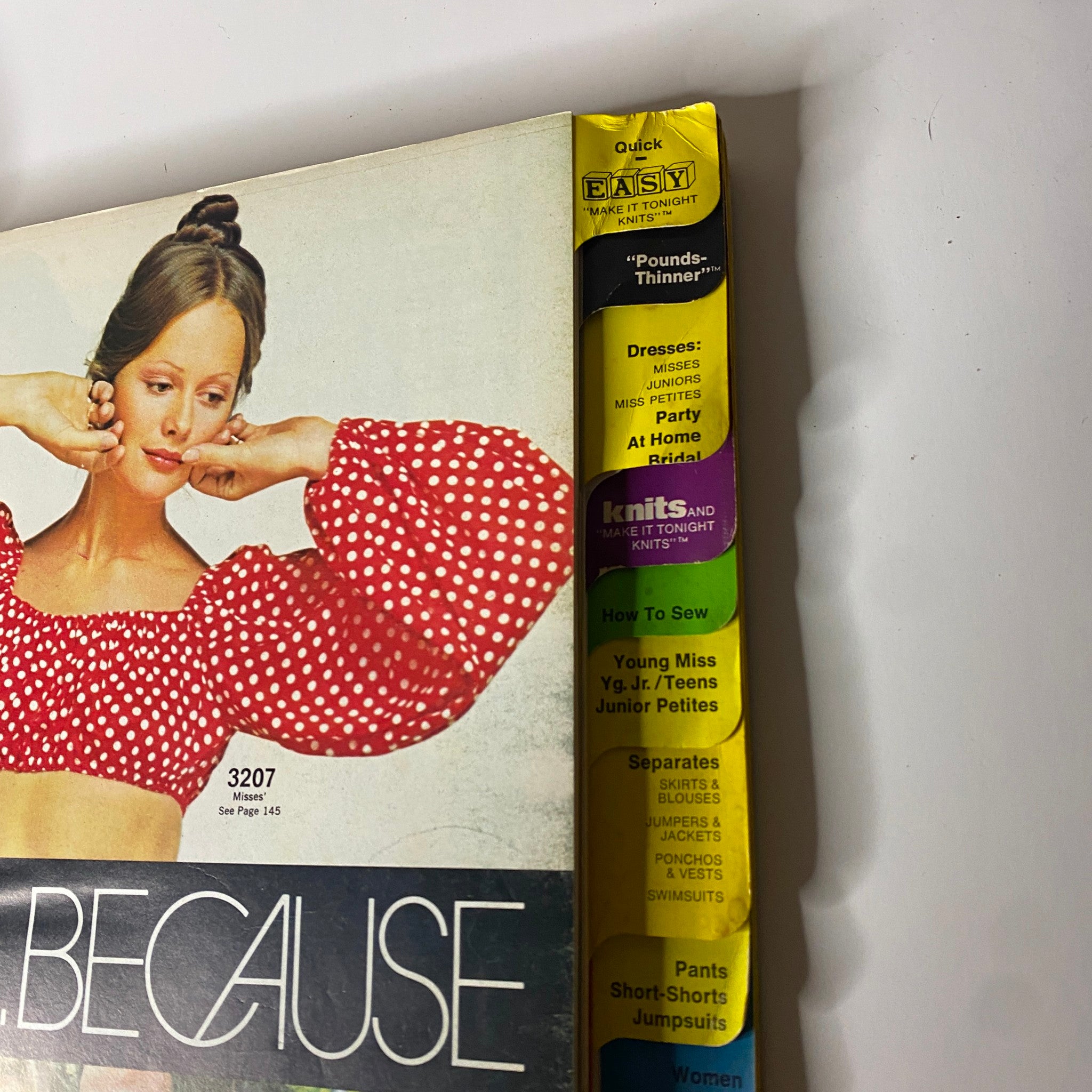Side view of the 1970s McCall's Hurry Up Easy Clothes Catalog displaying a model in a polka-dotted red top, emphasizing easy sewing patterns.