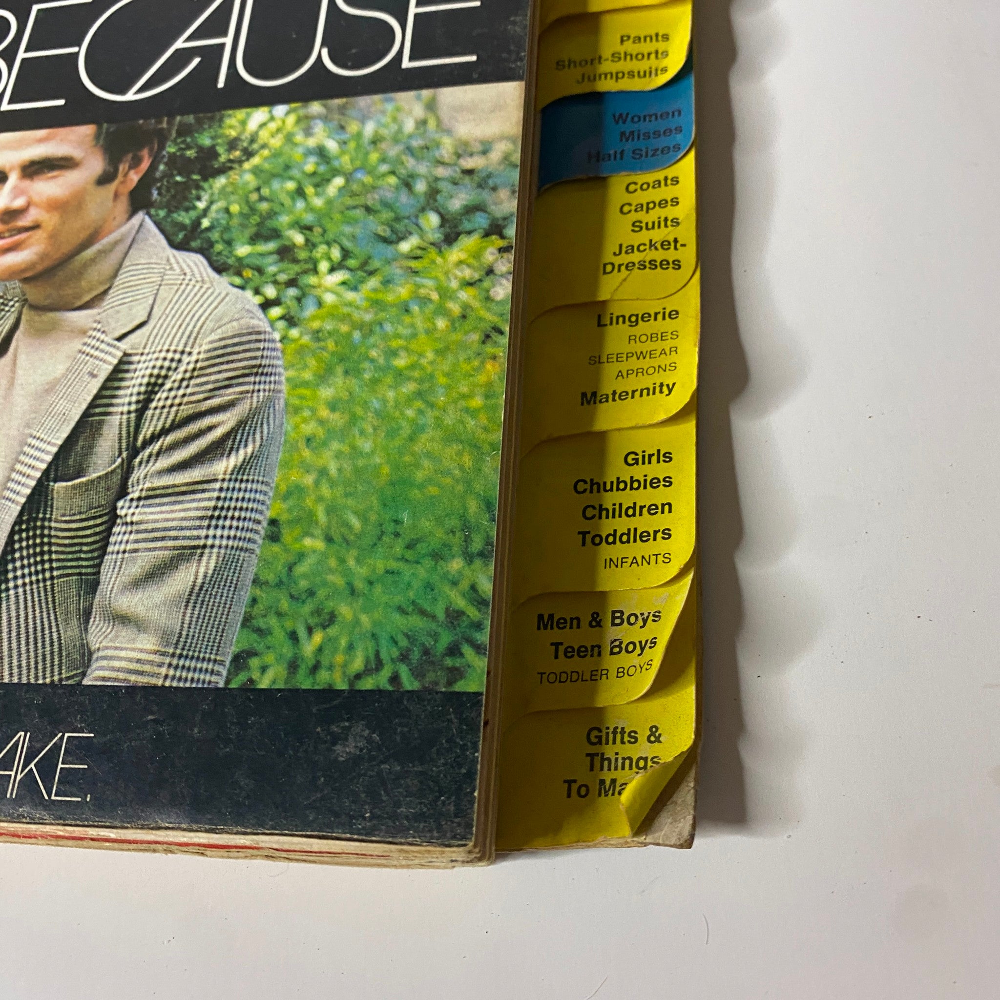 Front cover of the 1970s McCall's Hurry Up Easy Clothes Catalog with a stylish man in a checkered blazer, presenting the collection's diverse patterns.