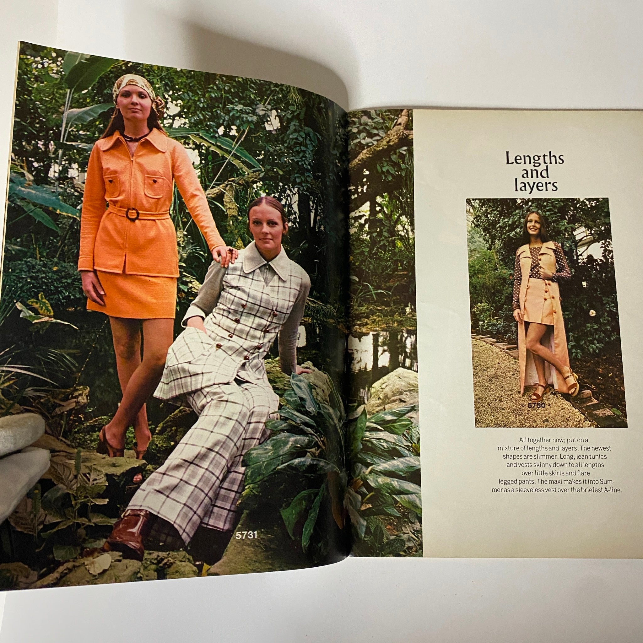 Double-page spread from the 1970 Butterick Summer Home Catalog displaying two women in vintage summer outfits. One wears a bright orange dress and the other a plaid ensemble, illustrating the lengths and layers popular in 1970s fashion.