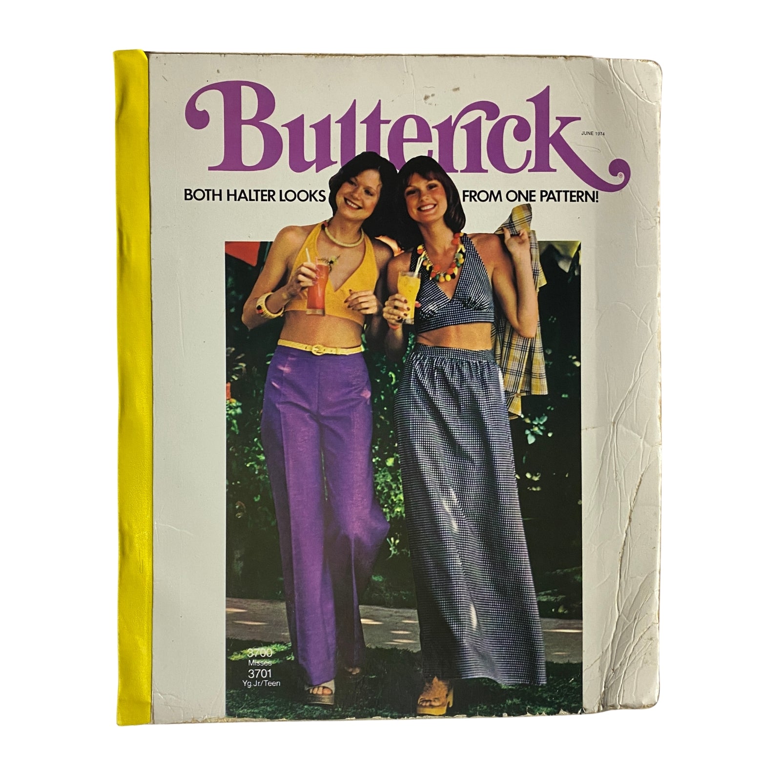 Cover of the 1974 June Butterick Catalog featuring two models showcasing halter top outfits. The colorful cover emphasizes versatile fashion options with the text 'Both Halter Looks From One Pattern!' suitable for vintage fashion enthusiasts.