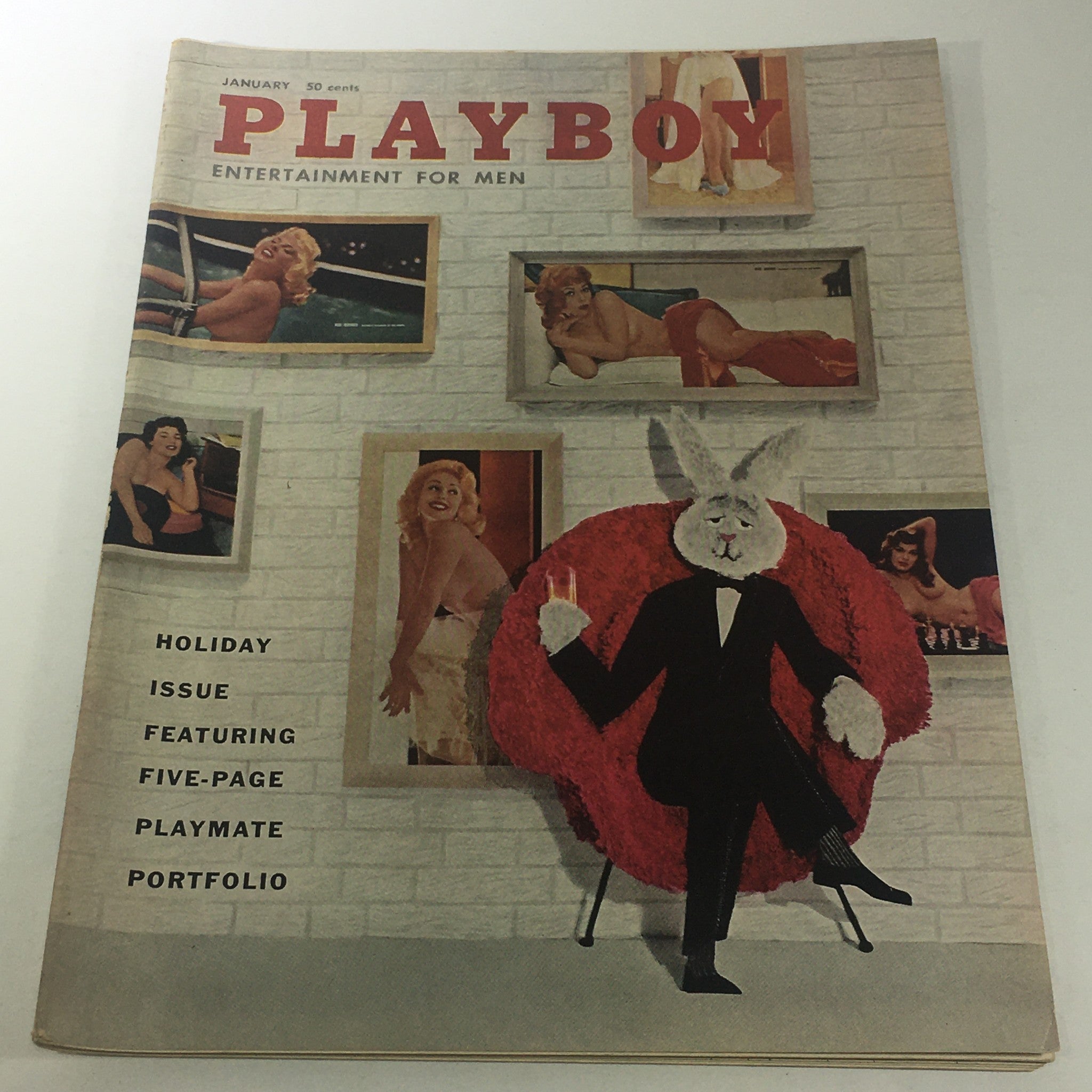 VTG Playboy Magazine: January 1958 Cover featuring a whimsical rabbit character in a suit, surrounded by vintage images of women, highlighting the Holiday Issue with a special 5-page Playmate portfolio.