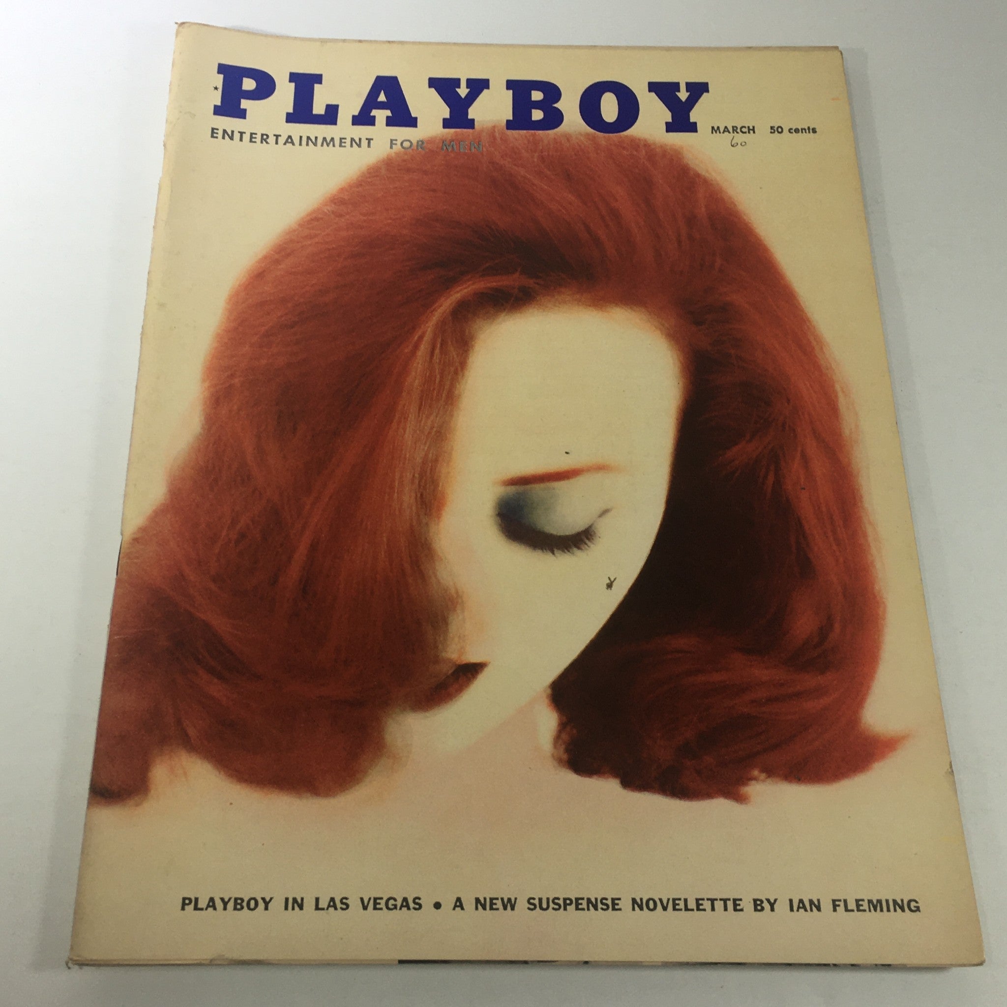 VTG Playboy Magazine: March 1960 featuring a stunning cover with vibrant red hair and a classic design. Iconic piece for collectors.