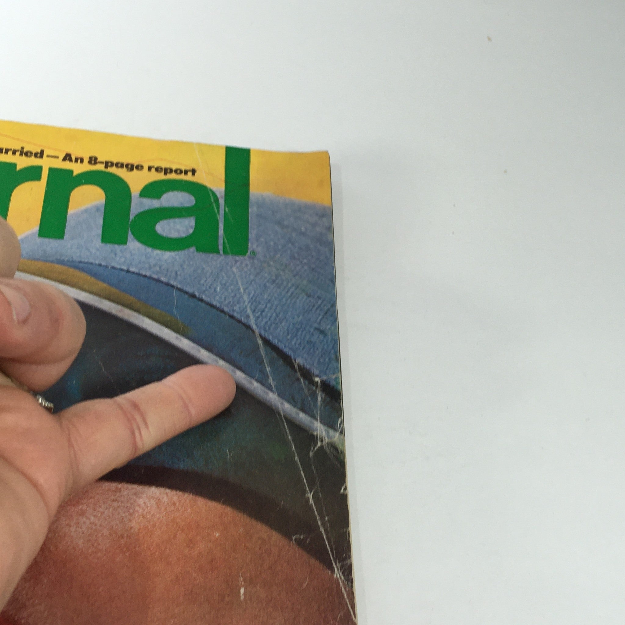 Side detail of VTG Journal Magazine: June 1976, highlighting the magazine's cover design with focus on the colors and materials.