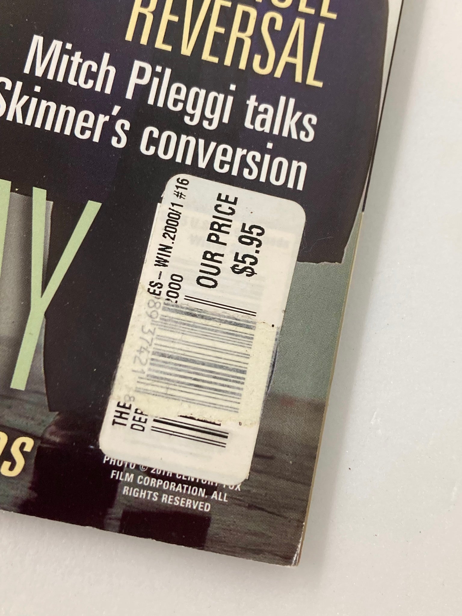 A close-up of The X-Files Magazine 2000 price sticker, showing 'OUR PRICE $5.95', which adds character to this collectible vintage magazine.