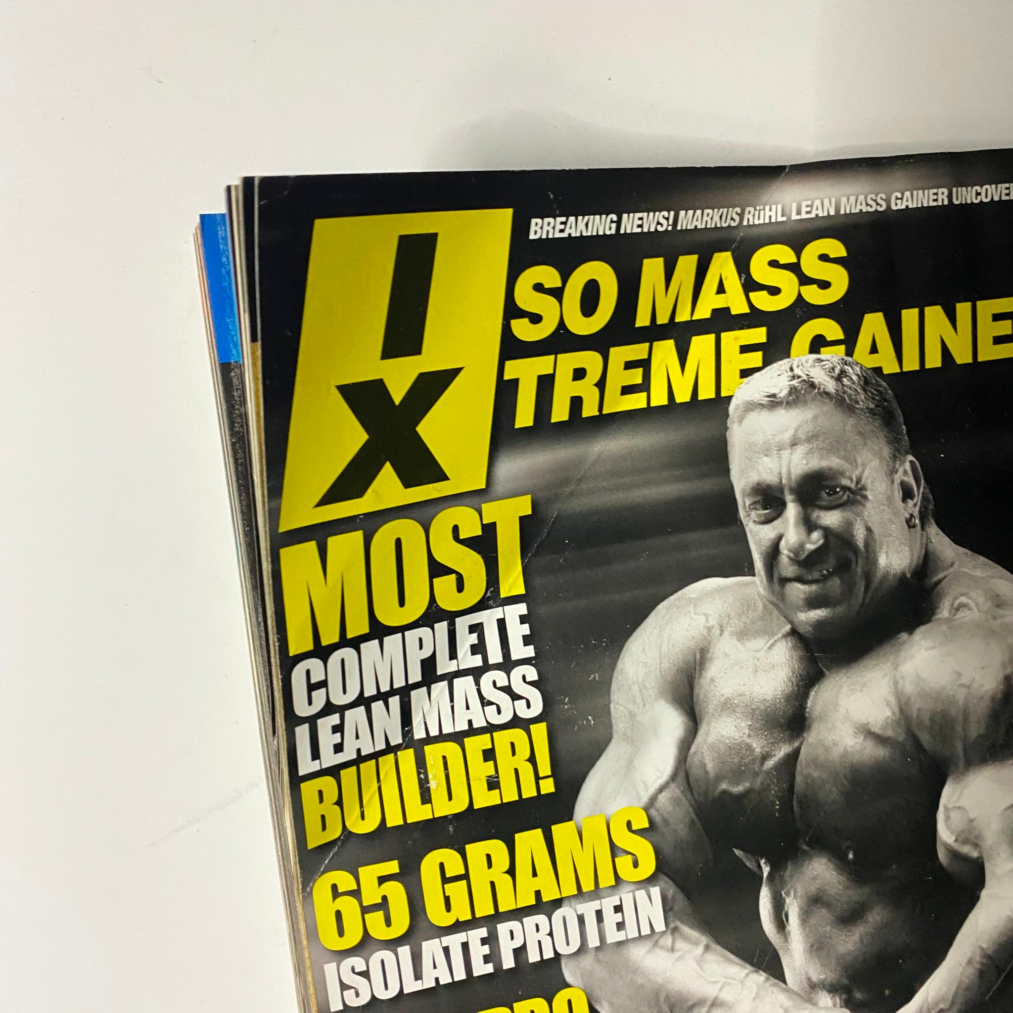 Detail shot of Muscular Development Magazine highlighting fitness supplements and bodybuilding techniques, relevant to enthusiasts and collectors.
