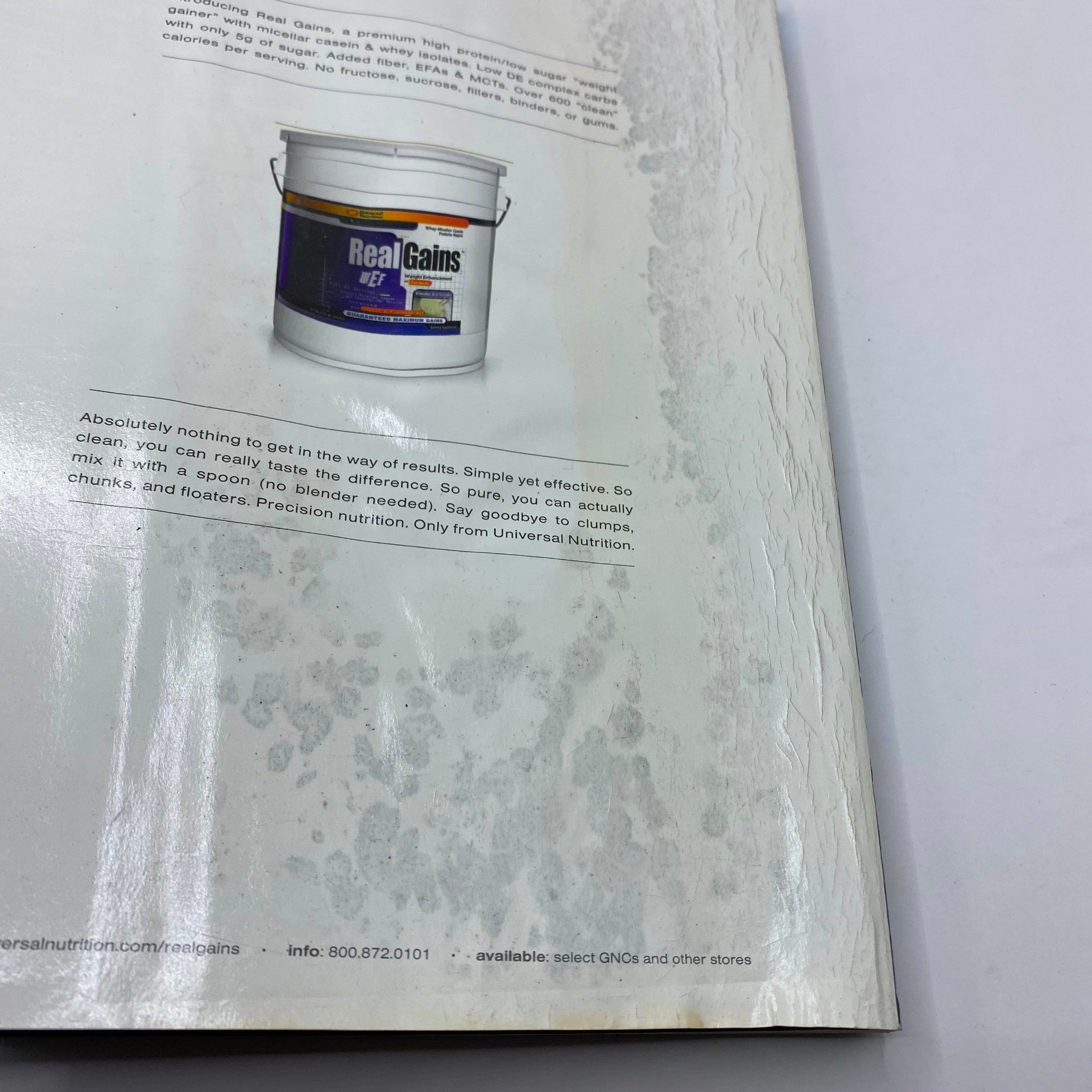 Inside page of Muscular Development Magazine December 2004 Lee Priest Cover No Label, featuring an advertisement for Real Gains nutrition product showing its container and emphasizing its effectiveness.