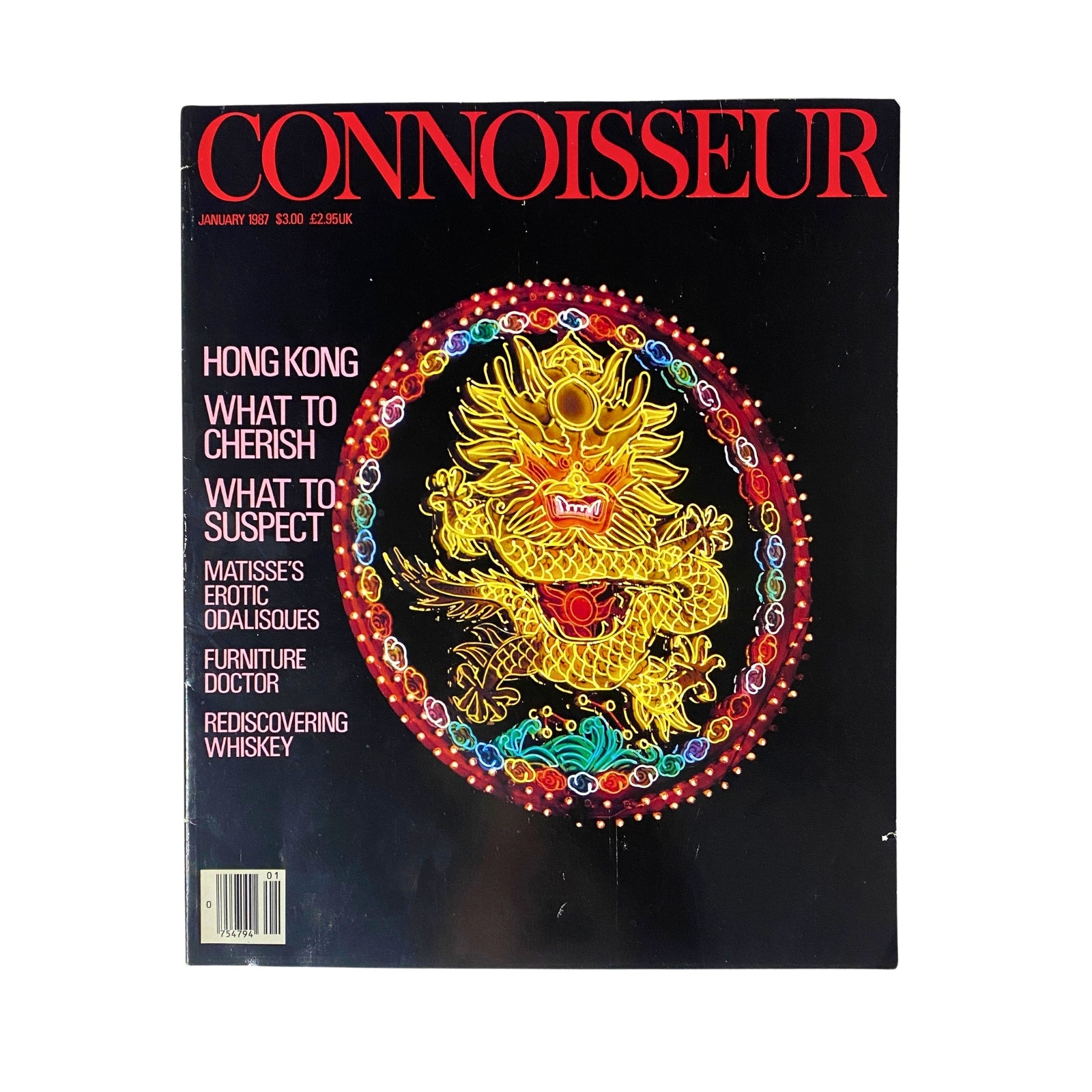 Cover of 'Connoisseur Magazine January 1987' featuring vibrant artwork of a dragon emblem, highlighting topics such as Hong Kong, Matisse's Odalisques, and rediscovering whiskey.